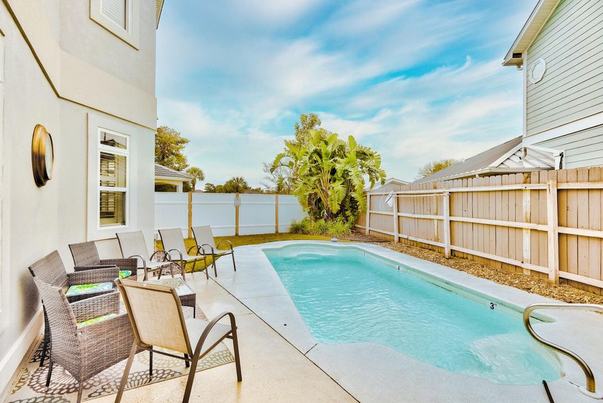 This fully furnished, 3,092 square foot, 4 bdr + bonus room/4 bath beach home offers deeded beach access, private pool, and a 2 car garage! Renovated from floor to ceiling, this gorgeous home is turnkey. Walk inside and a wet-bar welcomes you into a spacious and very open great room. A dual fireplace leads to gorgeous white granite kitchen, stainless steel appliances, and dining area overlooking backyard pool. The 1st level also offers a full bath perfect for showering off after a day at the pool or the beach. The spacious second level includes a large loft at the top of the stairs, 4 bedrooms + a bonus room with balcony currently being used as a 5 bedroom! The fenced-in back yard features a heated pool, perfect for guests and family gatherings. Terra Cotta Terrace is located off central