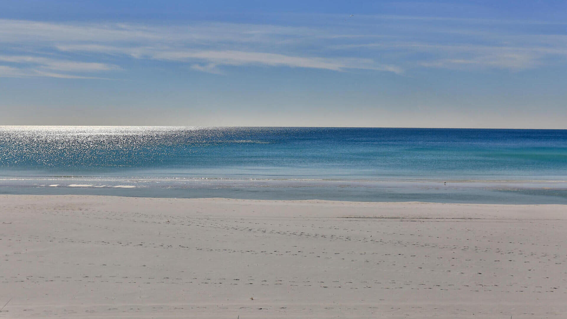 This Beautifully Renovated 2br/2ba condo is just a short walk to the Beach! Perfect for an investment or 2nd home. Lot of updates in May 2021 to include; New HVAC and hot water heater, 3 new TV's, new ceiling fans, new King and Queen mattresses, new recliner, area rugs and outdoor furniture. In Dec 2021 new commercial grade Laminate flooring, quartz counter tops, sink & faucet, cabinet doors & hardware, kitchen table & chairs and bar stools. In early 2021 also new stainless steel refrigerator, stove, dishwasher and was freshly painted. This Stunning 2nd floor condo comes ''Completely Furnished'' it's Turn Key Ready!! It opens to the beautifully landscaped yard and pool. There is assigned parking and a storage area below the clubhouse for owners use. There is also room for small home