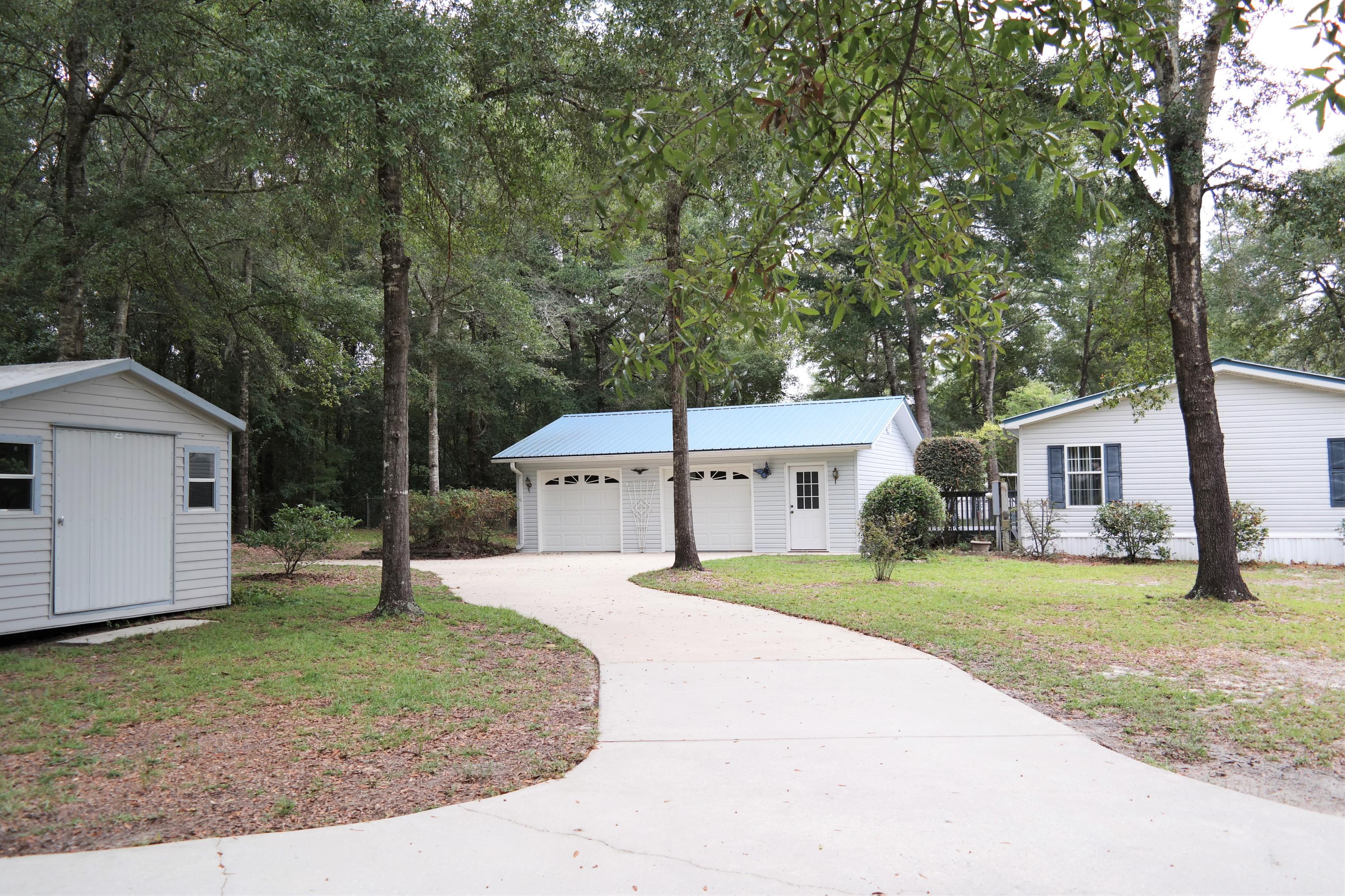 You'll want to act fast on this immaculate water view 2000 Skyline-Concept home on .93 acre! Home is 1772 SF (2752 including decks & garage). 3 BR, 2 ba with office. The pride of ownership on this one is evident as soon as you pull up to the yard! Exterior features include: Paved drive & parking; Oversized detached 2-car garage (24x30); storage shed; Gazebo; Fenced back yard; 14x14 back deck & 8x12 front deck (both with enclosed rails for small pets). Interior features include: drywall throughout; beautiful architectural detail; recessed lighting; built in speaker system; large utility room; Double vanities in master bath; Electric fireplace (home re-roofed in April 2013 & seller converted to electric); Skylights; Vaulted ceilings throughout; Breakfast bar & island in kitchen. HVAC 2012...
