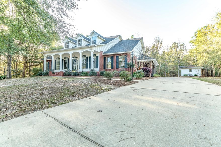 BUYER COULDN'T CLOSE, HERE IS YOUR 2nd CHANCE! ACT IMMEDIATELY! New Complete Renovation including NEW ROOF! Generator! Better than new construction, this stunning home is packed with character, loaded with details and trim work, and situated on a large 1 acre lot with mature trees! Stately curb appeal with huge front porch and a side porch with swing.This 3 bedroom 2.5 bath home features an office, a formal dining room (or den) a large breakfast room, a huge family room with center fireplace, and a drop dead gorgeous kitchen with solid wood white cabinetry, brand new stainless steel appliances, granite countertops, center island, pantry, and breakfast bar. The master bedroom has a private door leading to the covered back porch,