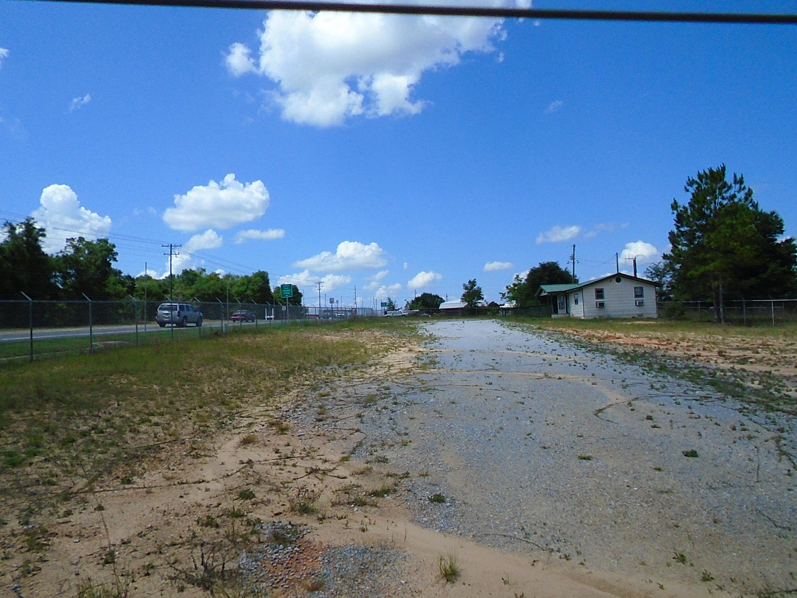 41.55 Acres of Industrial Property located in the County on busy Hwy 83 N. Property previously has been used as a salvage yard. Property is fenced. Includes a small office building with 1,012 sq ft. It has 2 offices, reception area plus kitchen and bath. There is also a 17,250 sq ft metal storage barn plus an additional metal building. The front section of the property has been cleared,fenced and is ready for use. There are wetlands on the property but no survey is available.