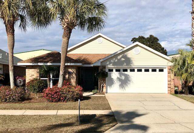 LOCATION is everything!  This meticulously maintained home is a mere 10-minute walk to the sugar white sands of the Gulf of Mexico. It's all-brick with vinyl trim which makes for easy upkeep. County land at the end of Dolphin is designated to make parking, ramps and restrooms for beach goers. Improvement to the home include a new roof and facia in 2022, attic insulation to R40, hurricane windows, garage door and motor, front and rear doors and panels for all doors. It has an alarm system, new back fence and gates. There is an added AC return register and all new AC vents.  All duct work has been cleaned and Aero-sealed for optimal efficiency.  Gas oven, heat and fireplace.  Private back yard, no North neighbors.  Come by and see this, make it your home, second home or rental investment