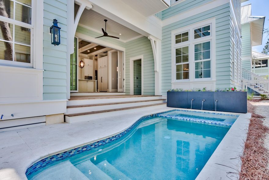 Set back in Watercolor's coveted phase three, this newly constructed 6-bedroom, eight bath home with elevator offers unrivaled quality. Throughout the home, the flow of the floor-plan, distinct custom finishes, statement tile, beamed ceilings, and stunning 5-1/4'' hardwood floors are evidence of master architect Gregory Jazayeri stunning design.Crossing the wide porch to enter the home, the flicker of the gas lanterns beckon guests to come inside. This Watercolor home offers a coveted main floor master retreat, third-floor bonus bunk room with fun and functional flex spaces on each level. Large windows throughout the home's interior are wrapped in wide trim, bathing the room in natural light. The 12' soaring ceilings pull the eye upwards, as coffered ceilings and inlay tongue and groove welcome you into the space.
 
The warm wire-brushed oak hardwood floors lead you to the heart of this 5,203 square foot home, where you will find an expansive coastal kitchen with a large knotty alder wooden center island, elegant designer custom cabinetry, an expedient pantry, and breakfast bar, providing the perfect backdrop to entertain. A suite of Thermador appliances and full size wine fridge, draped with the stunning quartzite countertops, completed the kitchen. The open concept great room creates an ebb and flow between the dining and living area complete with a gas fireplace and ample space for family gatherings or corporate retreats. Fusing indoor and outdoor living, a hinged Euro-wall reveals a well-lit sun porch just beyond the kitchen, featuring a beautifully appointed exterior living area where guests can enjoy alfresco dining year-round in the outdoor kitchen including a 30" gas grill and leads you to the private, heated pool & spa. 
 
On the first floor, a master suite with a dedicated bath and a large walk-in closet. A guest suite with a private bath on the second floor, as well as a large sitting room and oversized laundry room. The 2nd-floor master suite provides spacious accommodations that offer a luxurious master bath featuring dual vanities, a walk-in shower, and a separate soaking tub. The master suite is equipped with a roomy walk-in closet and direct access to a private 2nd-floor porch. An expansive third-floor bunk room offers the ideal retreat after a day at the beach, while the adjacent media room & wet bar provide a comfortable area to watch the big game or most recent movie premiere. Across the walkway from the main home is the one-bedroom carriage house with a full kitchen and large sitting area, offering privacy for guests or family. A two-car garage, additional guest parking, outdoor shower, and golf car parking completes the residence.
 
Watercolor is home to pristine beaches, world-famous amenity-rich 60-room Gulf-front Inn, renowned golf courses, beach club, resort pools, and acres of gardens and footpaths. Within walking distance to Seaside, Watercolor is truly the gem of the Emerald Coast.
