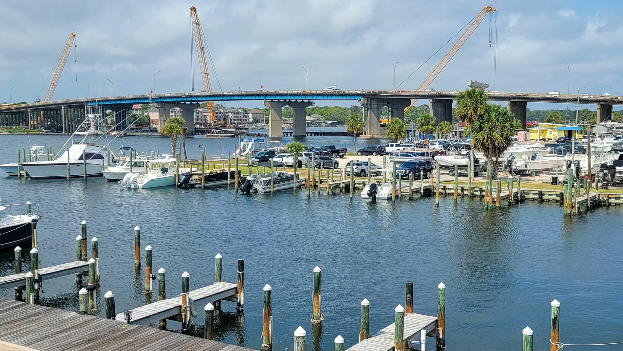 $10K CREDIT TO BUYERS AT CLOSING WITH ACCEPTABLE OFFER! Comes with DEEP WATER BOATSLIP in front of townhome! Welcome home to this WATERFRONT 2br 2.5ba townhome, located in the quiet, GATED, Clipper Cove Community on Okaloosa Island. Unit to be sold AS IS, furnishings included. Amazing location for anyone looking for a permanent residence, rental investment (6+ months or longer) or home away from home. LOW HOA DUES, $275/MONTH! Approx. 1 mile to downtown Ft Walton Beach, 6 mi to Hurlburt AFB, and 6 mi to Destin! Kitchen has breakfast nook, breakfast bar overlooking the dining/living area, and brand new refrigerator. Dining/living space is open to the patio with water views of the marina and sound! 1st floor also has half bath, laundry room (w/d included), and under-stairs storage. Upstairs are two spacious master suites, both with private full bathrooms. Master bedroom has a spacious covered balcony, perfect for watching boats travel on the sound.
Clipper Cove has a large waterfront Gazebo / picnic area, great for relaxing, fishing, enjoying the sunsets & sunrises... Enjoy the beautiful pool area surrounded by brick pavers & lush tropical landscaping. Roof is made of extremely durable stone-coated steel tile. Back gate leads to boardwalk which takes you to beach access. HVAC 2019. Water Heater 2023. Owners allowed 1 pet per household. No short term rentals allowed.