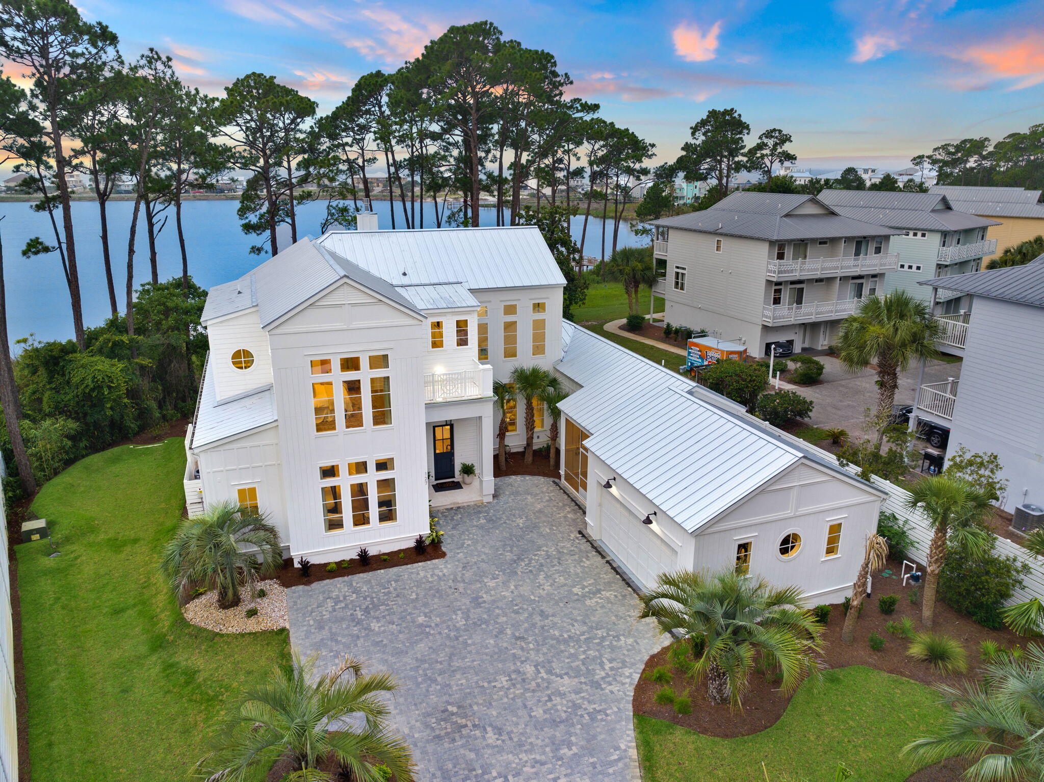 Welcome to this magnificent new construction home in Dune Allen Beach. Nestled on the serene Oyster Lake, this fully furnished gem offers over 4000 Sq ft. of pure luxury. With meticulous attention to detail, it boasts five bedrooms, four full baths, and two half baths, providing ample space for relaxation and entertainment.Perched on a rare Coastal Dune Lake, the home enjoys a prime location with a large wooded lot surrounding it. As you step onto the property, you'll be greeted by a private swimming pool and spa, beckoning you to unwind and soak up the Florida sunshine. Imagine leisurely evenings spent on the expansive patio, complete with an outdoor kitchen, perfect for hosting unforgettable gatherings.