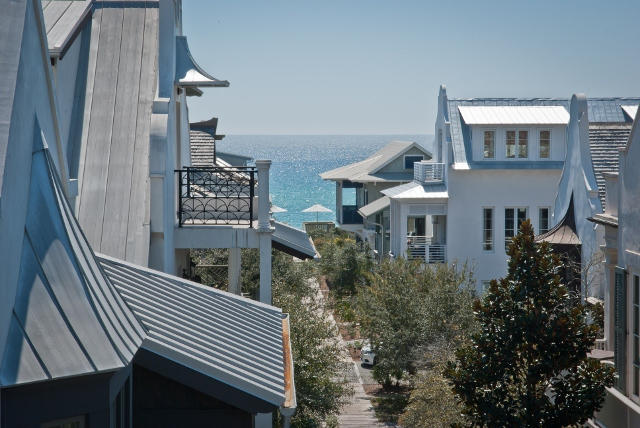 EXCEPTIONAL HOME AT AN EXCEPTIONAL PRICE, this stylish Beach House portrays the architecture of a classy Island Home with painted wood clad walls and sturdy construction. The open Living/Dining/Kitchen enjoys Level 2 to take advantage of the Gulfviews from the spacious wrap-a-round Balcony. The high Beamed Ceilings and transomed French doors flow light and Gulf breezes through the generous space. The custom stone Fireplace anchors the massive Living area. Also, a dumbwaiter at the entry simplifies the transfer of groceries to the Kitchen. A versatile climate controlled Basement is perfect to host Wine Racks and Wine Cooler as well as Yolo Boards & Kayaks. In Level 1, shuttered antique doors from Bali welcome Guest from the Boardwalk entry, a Rosemary Beach trademark.