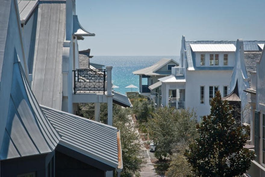 EXCEPTIONAL HOME AT AN EXCEPTIONAL PRICE, this stylish Beach House portrays the architecture of a classy Island Home with painted wood clad walls and sturdy construction. The open Living/Dining/Kitchen enjoys Level 2 to take advantage of the Gulfviews from the spacious wrap-a-round Balcony. The high Beamed Ceilings and transomed French doors flow light and Gulf breezes through the generous space. The custom stone Fireplace anchors the massive Living area. Also, a dumbwaiter at the entry simplifies the transfer of groceries to the Kitchen. A versatile climate controlled Basement is perfect to host Wine Racks and Wine Cooler as well as Yolo Boards & Kayaks. In Level 1, shuttered antique doors from Bali welcome Guest from the Boardwalk entry, a Rosemary Beach trademark.