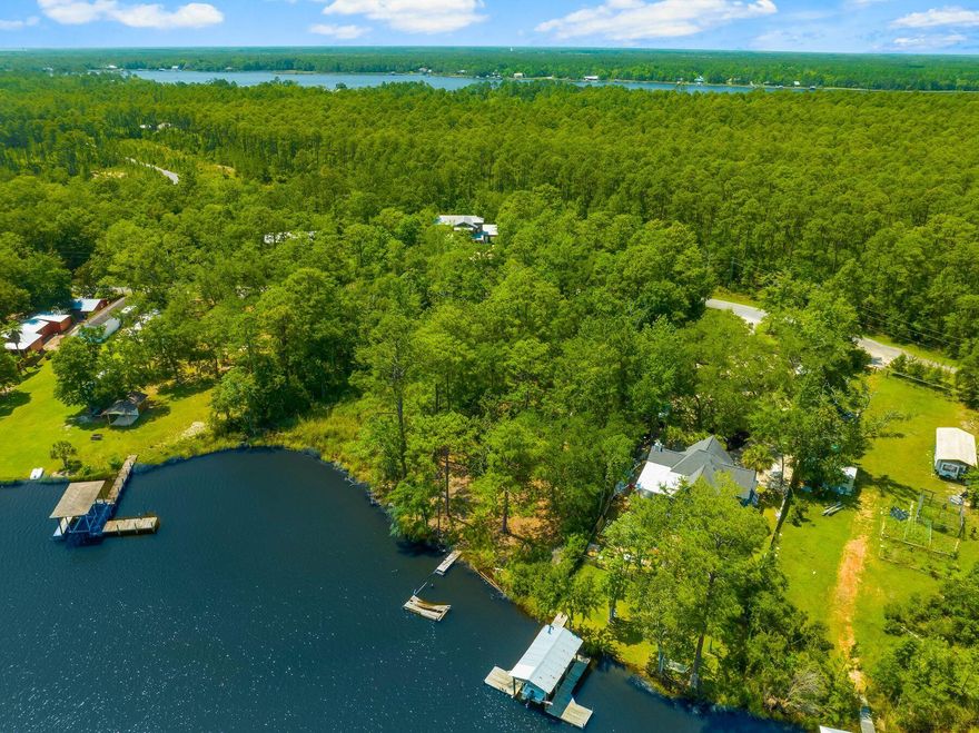 Nestled along the pristine shores of Freeport, this captivating bayfront lot beckons with the allure of a boater's paradise, offering an idyllic retreat amidst the tranquil waters of Choctawhatchee Bay. Situated on a secluded, no HOA street, this haven exudes exclusivity and serenity, promising privacy and seclusion of bayfront living without sacrificing convenience. Whether it's a waterfront estate with sweeping views of the bay, or crafting a cozy coastal retreat, the potential of this lot is as vast as the horizon stretching before it. For the individual seeking a harmonious blend of privacy, tranquility, and untapped potential, this bayfront lot in Freeport stands as a testament to the beauty of coastal living and the promise of a life well-lived amidst the timeless allure of the sea.