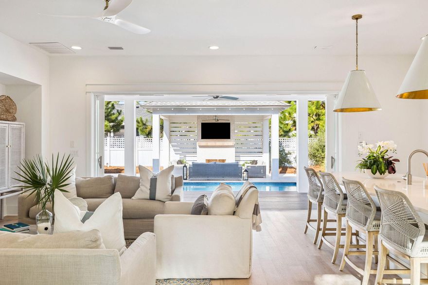 Experience refined coastal living at its finest in The Suffolk, a sought-after floor plan in Watersound Origins. This is one of the few layouts that offers two bedrooms with en-suite bathrooms on the main level, a feature highly desired for convenience and versatility. Crafted by Romair Homes, this exceptional residence blends timeless elegance, modern comfort, and effortless indoor-outdoor living.This thoughtfully designed home features 4 bedrooms, 4.5 bathrooms, a 2-car garage, and a spacious bonus room that can easily function as an additional bedroom. The expansive great room serves as the heart of the home, where 16' Jeld-Wen sliding glass doors open to a private outdoor oasis complete with a resort-style pool, spa, and covered cabana retreat, perfect for entertaining or relaxing in style.
The gourmet kitchen is a chef's dream, appointed with quartz countertops, custom soft-close cabinetry, and top-tier Sub-Zero/Wolf appliances. Spa-inspired bathrooms with elegant porcelain tile further enhance the interior with sophistication and coastal charm.

Located within the highly coveted Watersound Origins community, this home provides access to premier amenities, including Village Commons with its resort-style pool, state-of-the-art fitness center, pickleball and tennis courts, event lawn, and the distinctive 6-hole Origins Golf Club. Scenic walking and biking trails, neighborhood parks, and direct access to Lake Powell offer endless outdoor enjoyment. The growing Watersound Town Center, just minutes away, features Publix, boutique shops, restaurants, and essential services.

Homeowners may also JOIN the exclusive Watersound Club, offering private beach access, multiple clubhouses and pools, dining, and golf across three private courses, including the spectacular new Lifestyle Center at Camp Creek.

Blending modern luxury with natural beauty, The Suffolk offers an extraordinary coastal lifestyle thoughtfully designed for comfort, elegance, and effortless entertaining.