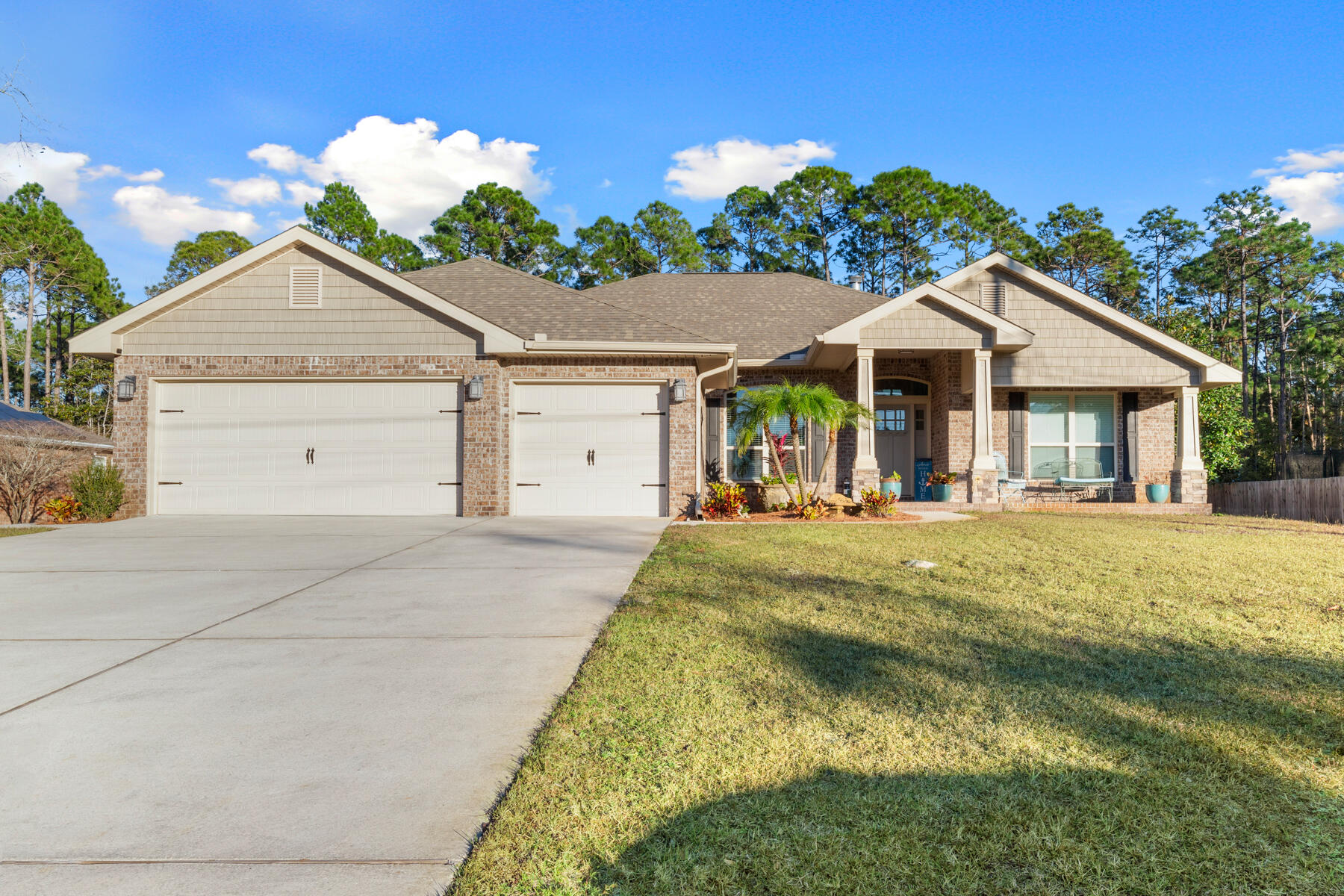 WOW! SPECTACULAR & SPACIOUS 2018 HOME!  4 BR / 3 FULL BATH /  PLUS OFFICE / 3 CAR GARAGE ON .88 ACRES! BEAUTIFUL STONE COLUMNS WELCOMES YOU ONTO A COVERED FRONT ENTRY. DRAMATIC ARCHWAYS, HIGH CEILINGS AND A STONE LEDGE FIREPLACE SATISFY 1ST IMPRESSIONS. KEY FEATURES:KITCHEN - Upgraded SS Appliances, Granite countertops, New sink & Faucet, Pantry & Eat up bar that overlooks breakfast nook area with bay windows. LIVING ROOM - Roomy w/ high Ceilings w/double ceiling fans, Gorgeous Stone Ledge accented FP w/mantle & slate stone hearth. CoreTec Pro LVP flooring. LR opens to spacious Dining Rm. MASTER BR - Roomy w/Recessed Box Ceilings, Fan, NEW Carpet, His/Her Walk-in Closets & door to covered lanai. MASTER BATH - Separate double vanities w/ granite, Tiled shower with glass door and separate garden tub w/tile surround.
ADDITIONAL FEATURES: Spacious BEDROOM #2 is privately nestled w/own bathroom for a perfect guest suite & NEW Carpet. BEDROOMS 3 & 4 are  roomy & NEW Carpet. 14x13 BONUS ROOM/OFFICE w/double glass french doors, vaulted ceiling, large window, fan & polished LVP Floors. Separate POOL BATH #3 is convenient to bedrooms 3 & 4 and opens to back lanai for convenient access to a future pool. 3 Car Garage w/new paint. Separate LAUNDRY ROOM w/cabinetry. Freshly Painted large YARD SHED w/windows, entry door & large side roll up door perfect for a riding mower. Gutters. Garage ceiling storage rack. Arched Doorways. Over/Under cabinet lighting in Kitchen. Outside Vented Microwave. Fabric Shield Hurricane Panels. Irrigation system w/well pump. Outdoor cold water rinsing Shower. Location only 1/2 mile to HOA Deeded East Bay Boat Launch. Quick commute to Beaches, Hurlburt AF Base & shopping. 
Membership in HBTS HOA includes: Access to Multi Million $$ rec center - 8 Clay Tennis Courts, Beach House (Event Hall), Fishing dock, RV/Tent Campground, 10 RV (Back Ins) - 6 Tent Sites, Lap Pool, Family Pool, Baby Pool, Full Weight Room and Cardio, Men/Women Locker rooms, Volleyball Court, Ball Field, Basketball Court, Boat Launch (East Bay) & more!
Schedule your tour today!