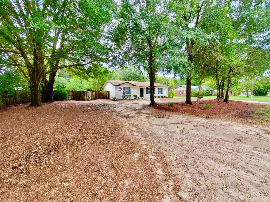 3/2 Renovated Home on close to 1/2 Acre (0.46 AC) Updated Kitchen & brightened up with New Granite counter-tops, new Back Splash, Lights, sink & faucet & New Stainless Steel Appliances. Updated Bathrooms with new vanities, lights, mirror and waterproof flooring. New laminate flooring throughout the home Laminate in main areas and carpet in bedrooms. New blinds, New Paint inside and out. Enjoy the large fenced in backyard with Open Patio, covered porch and an area to work on your hobbies in the 1 car carport, covered storage area and storage shed.  Room sizes approx. buyer to confirm.