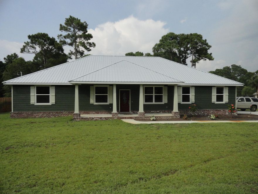 New home built by Ray Hall. This 4 bedroom 2.5 bath home is ready for you and your family to move in today. Large corner lot located in Holiday Shores Estates offers you convenience to shopping, resturants, the beaches, golf, & so much more. The spacious kitchen with stainless appliances, shaker cabinets, granite counters, and breakfast bar open to the dining room on one side and large breakfast nook on the other. The large living room with wood floors gives you pleanty of room for friends & family entertainment. The large master bedrooms leads to the elegant bath that includes a garden tub, separate shower with tile surrounds & 2 walk-in closest. The oversized garage gives you room for all the toys.