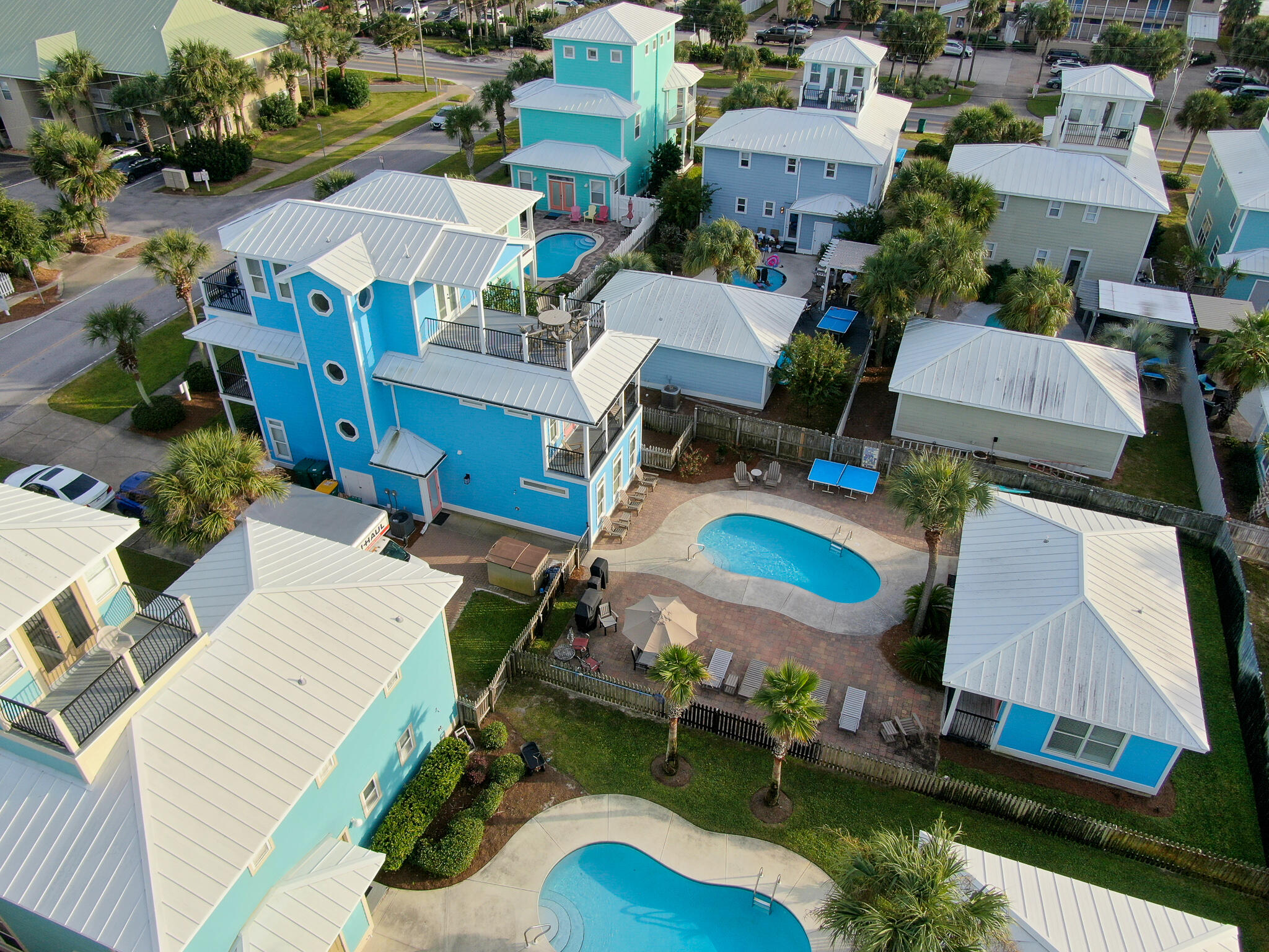 Looking for a fabulous vacation rental home located just yards away from the Gulf? Welcome to Blue Coconut! Then you won't want to miss this incredible home and all that it has to offer including a guest house and pool. And did I mention a rental machine? In the last 2 years this home has all new interior and exterior paint, new interior and exterior light fixtures, painted kitchen cabinets, Main house and Guest House HVAC systems, dishwasher, microwave, dryer, pool equipment, ship lap around breakfast bar, couches, coffee table, dining set, TV cabinet, lamps, rugs, towels, sheets, decor.The first floor features the living/dining/kitchen area, laundry room, full bath, and a custom bunkroom with 2 queen size and 2 double size bunks! On the 2nd floor you will find a Master suite with
