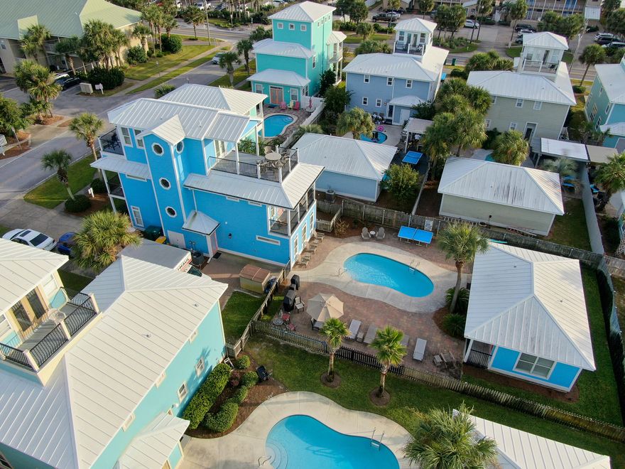 Looking for a fabulous vacation rental home located just yards away from the Gulf?  Welcome to Blue Coconut!  Then you won't want to miss this incredible home and all that it has to offer including a guest house and pool.  And did I mention a rental machine?  In the last 2 years this home has all new interior and exterior paint, new interior and exterior light fixtures, painted kitchen cabinets, Main house and Guest House HVAC systems, dishwasher, microwave, dryer, pool equipment, ship lap around breakfast bar, couches, coffee table, dining set, TV cabinet, lamps, rugs, towels, sheets, decor.The first floor features the living/dining/kitchen area, laundry room, full bath, and a custom bunkroom with 2 queen size and 2 double size bunks!   On the 2nd floor you will find a Master suite with