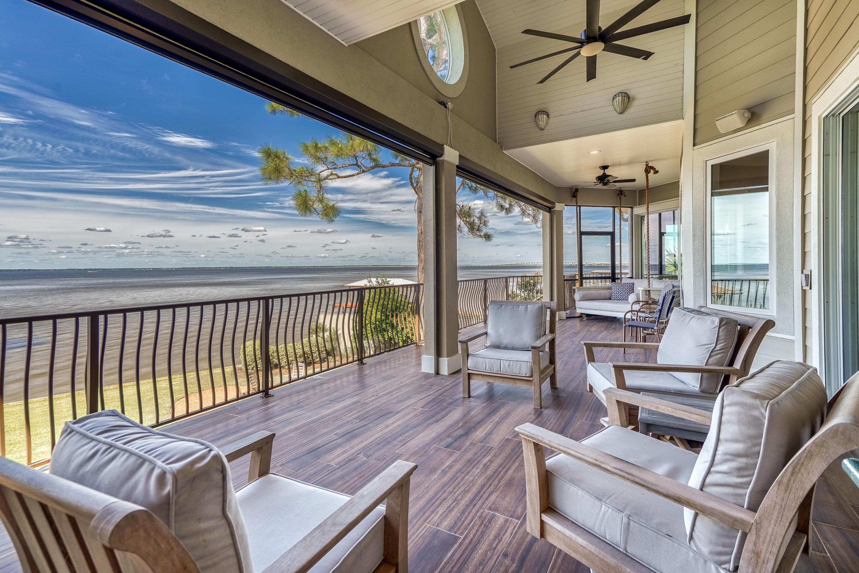 Bay Front Compound 5 mins from 30A beaches. Right at -1/2 acre w/ 100 waterfront feet directly on Choctawhatchee Bay (Big Water). 8 ft privacy fence surrounds perimeter of the property w/gated entrance to your waterfront oasis. Heated pool, hot tub, pool deck, and outdoor pavilion custom built in 2011 creating a private paradise just minutes from the beautiful South Walton Beaches. 5 bedrooms, 3 1/2 bathrooms, a formal living room on the second level overlooking the bay, a large bonus living room on the ground level, and plenty of storage. 3 car over sized garage. Features incl elevator shaft, NEW kitchen, Remote retractable screen porch, All new solid surface flooring, brand new dock and boat lift for large boat, Elegant yet comfy bay living at its finest. Back yard is your playground