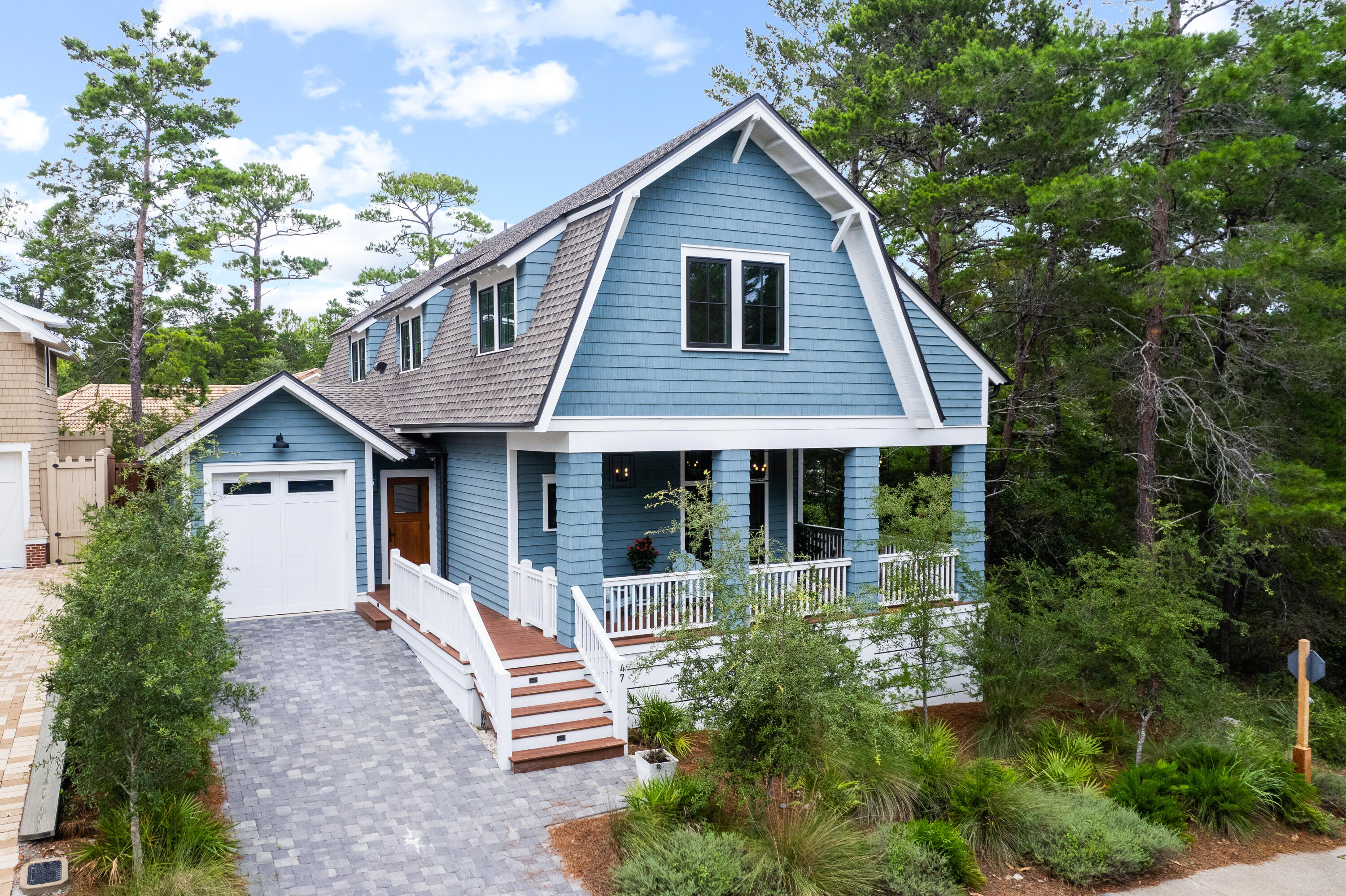 Nestled within the gates of Draper Lake Coastal Village, this gorgeous Gambrel designed home was completed in 2020 with an emphasis on timeless elegance and superior craftsmanship. Offering an ideal combination of both indoor and outdoor living spaces, the design and finishes throughout the property come together to create a beautifully curated home. As you enter the home, you are welcomed into the living/dining space with double doors leading to an expansive covered porch surrounded by a lush garden. A butler's pantry was added in 2021, as well as several updated finishes. One master bedroom is located on the first floor with a full ensuite bathroom and the second floor master offers beautiful views of Draper Lake.