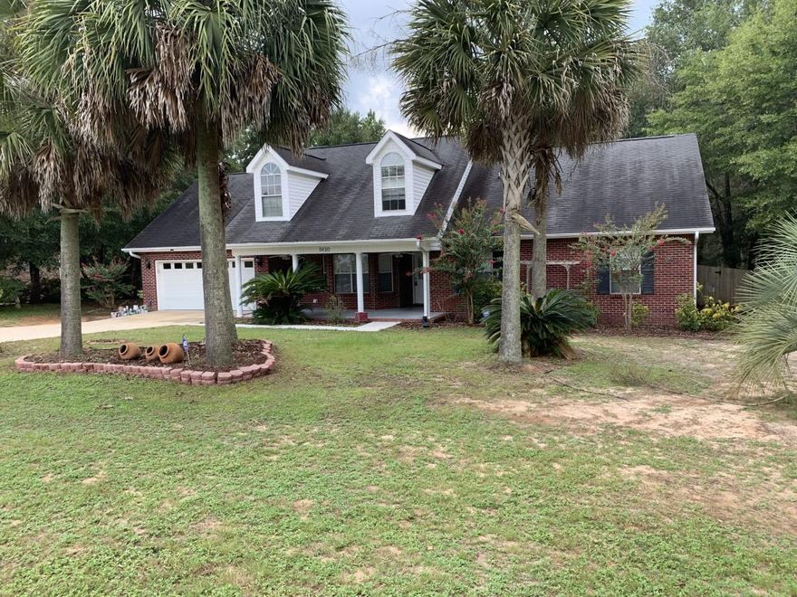 A large country front porch welcomes you to this wonderful home. Inside, you will find a spacious living room with vaulted ceilings, a gas fireplace, and nooks with electrical outlet (perfect for holiday decorations). The eat-in kitchen has BRAND NEW STAINLESS STEEL APPLIANCES and leads out to a large screened in patio with 2 ceiling fans. There is also a doggy-door for your pets! The spacious formal dining room will give you plenty of space for entertaining. The home has TWO master suites, one upstairs and one downstairs. All bedrooms, the living room, and the dining room all have laminate wood flooring (NO CARPET!), The kitchen, bathrooms and laundry have tile. The back is fenced with additional land behind the fence. A 24'x12' shed conveys. Come see this today!