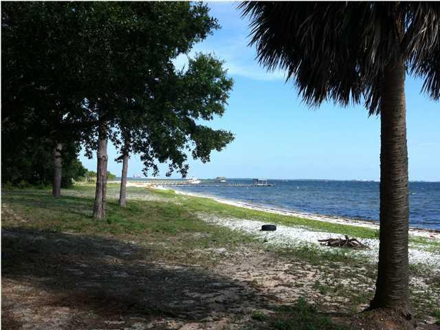 Located next to Meigs Park, a bayfront location with views to Destin. This lot is not waterfront--the county land is between the lot and the bay.