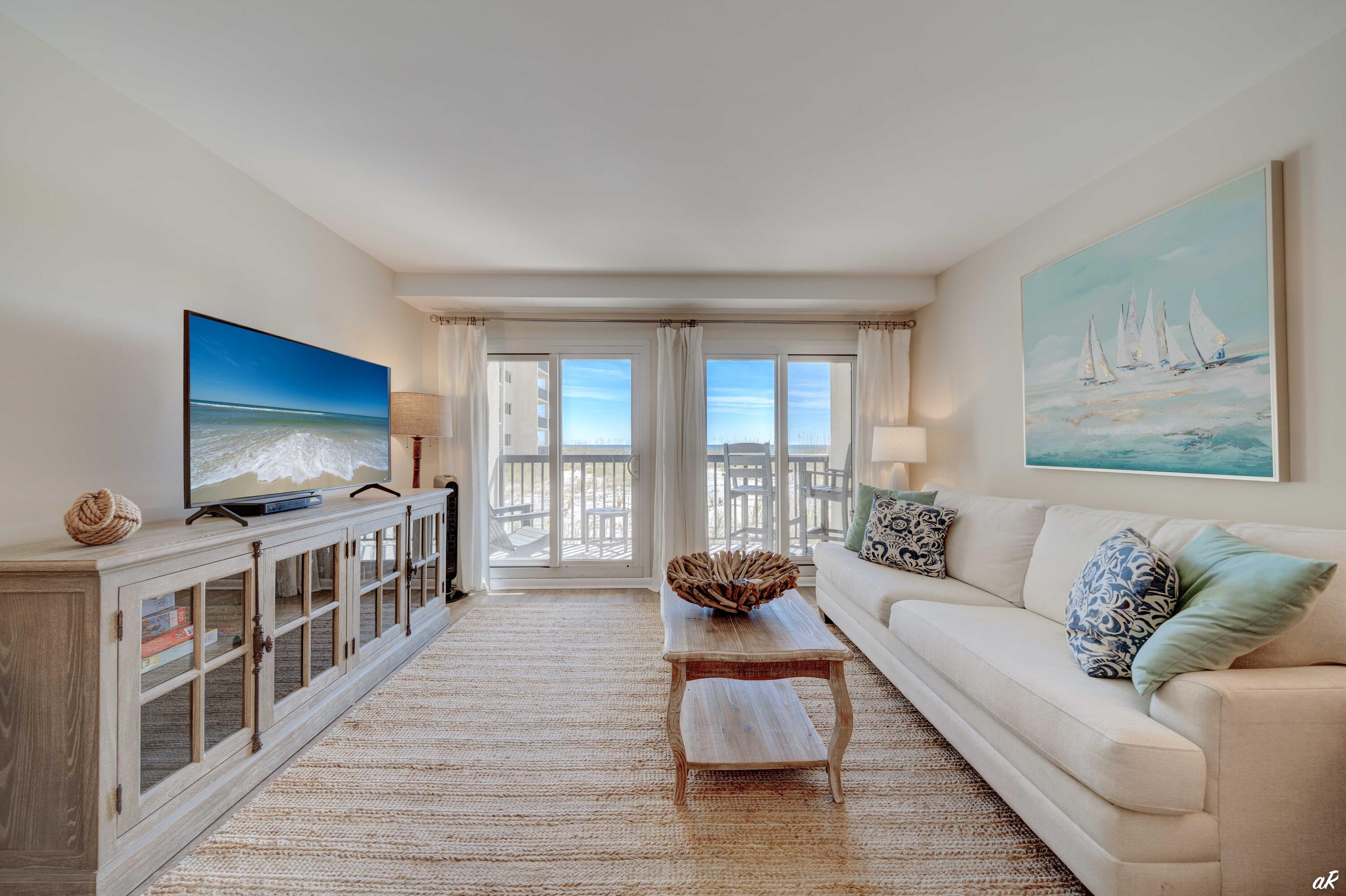 CURRENTLY UNDER CONTRACT, SELLER WILL CONSIDER BACKUP OFFERS. You just found the Emerald Coast's best-kept secret. Nestled snugly between Lake Powell and the Gulf of Mexico (the only community so perfectly positioned), and bordered to the west by Camp Helen State Park and to the east by low-density Carillon Beach, Pinnacle Port is a hidden gem few have found--lucky you! Once you're inside the gated access, you'll meander almost to the shoreline to arrive at your coastal retreat. Step inside and you're greeted by your expertly designed condo, newly renovated in 2021 and updated even further in 2022. Whether you're in the kitchen, the living space, or the spacious master bedroom, you'll enjoy direct views of sugar sands and emerald waters.