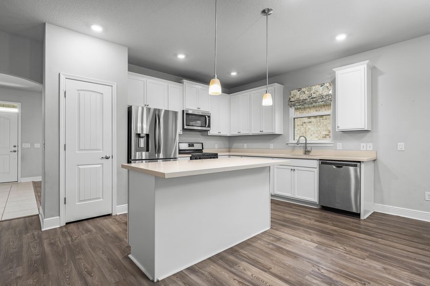 Welcome to your dream home nestled within the Sunrise gated community! This 2020 residence boasts timeless elegance and modern comforts. Spanning 1826 square feet, this abode offers a harmonious blend of functionality and style. Upon entry, you are greeted by a versatile flex space, ideal for a home office, library, or even a cozy sitting area. As you leave the foyer, you're embraced by an inviting open floor plan seamlessly connecting the kitchen and living room, perfect for effortless entertaining and daily living. The warmth of a gas fireplace adds an inviting ambiance, perfect for chilly evenings or cozy gatherings. Plantation shutters adorn every window, offering both privacy and a touch of sophistication throughout the home. Tray ceilings grace both the living room and Primary,