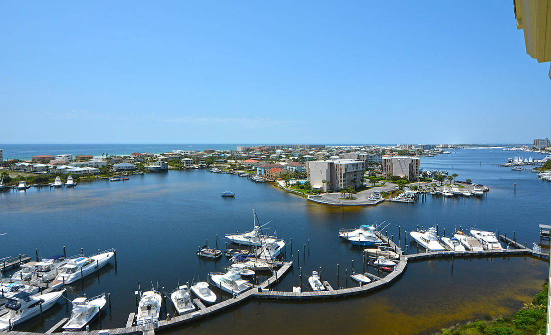 Expansive views of the prestigious Destin Harbor and the Gulf of Mexico. Freshly painted and new carpet! This gorgeous 4 bedroom, 4-1/2 bath penthouse exemplifies the open space concept with a total of 3,719 sq. feet. This home is perfect for a primary or second home. Interior features include tile throughout the unit, crown molding, high ceilings, recessed lighting, decorative columns and a spacious private tiled veranda. The kitchen is equipped with stainless steel appliances, an icemaker, custom backsplash, with a large granite breakfast bar.