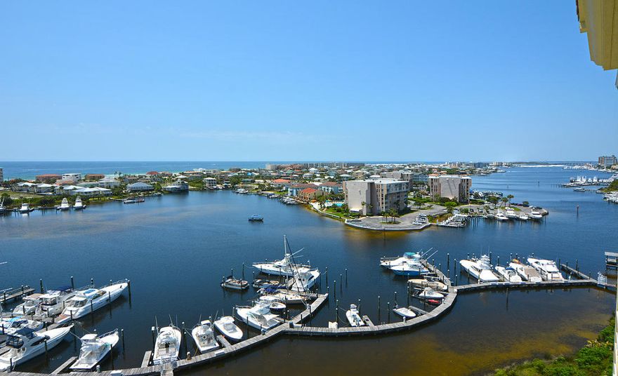 Expansive views of the prestigious Destin Harbor and the Gulf of Mexico. Freshly painted and new carpet! This gorgeous 4 bedroom, 4-1/2 bath penthouse exemplifies the open space concept with a total of 3,719 sq. feet. This home is perfect for a primary or second home. Interior features include tile throughout the unit, crown molding, high ceilings, recessed lighting, decorative columns and a spacious private tiled veranda. The kitchen is equipped with stainless steel appliances, an icemaker, custom backsplash, with a large granite breakfast bar. The unit showcases two master suites equipped with a large walk-in closet. The master bath features a jetted tub, separate shower and double vanities.  Both suites have private access to the veranda. Four parking spaces in the Marbella garage convey along with a storage unit. Marbella Condominium sits on a 35 ft. bluff and is in the heart of the Destin lifestyle of boating, golfing, dining, shopping, and the beautiful white sand beaches of Destin. Amenities include fitness room, clubhouse, pool, and access to professional managed 56-slip Marina. All dimensions to be verified by Buyer.