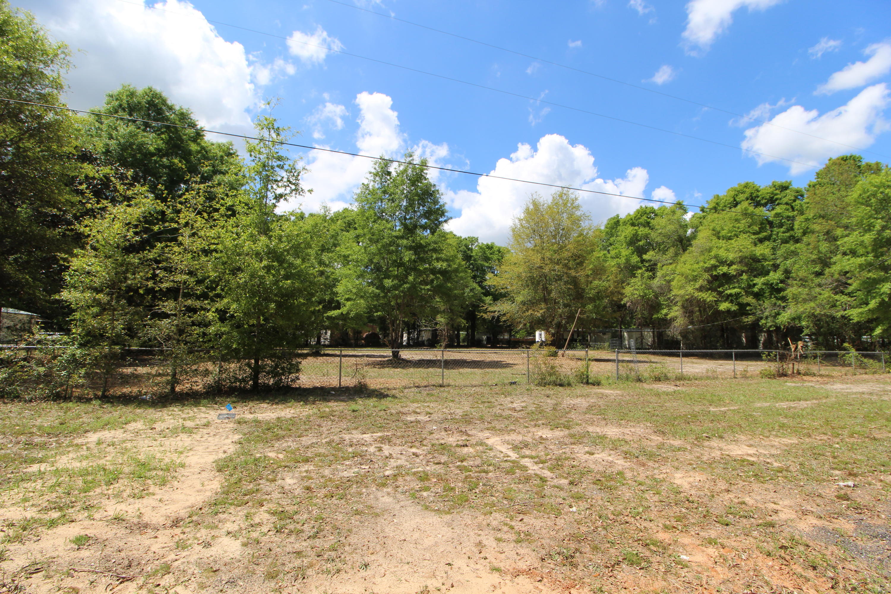 Large vacant lot, recently cleared! One power pole, a tap, and septic tank are on the property. Drive by to see it today!