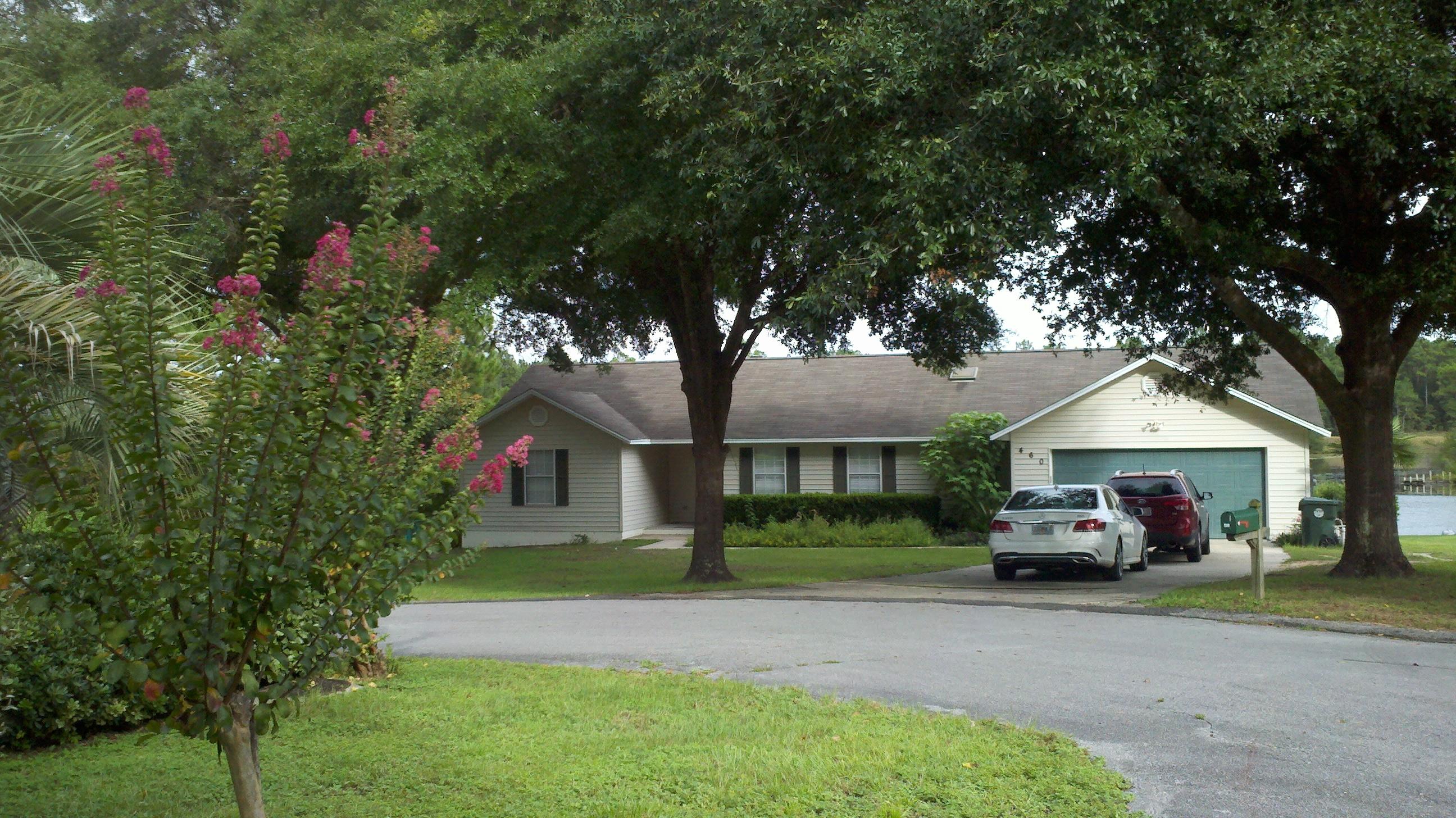DRASTIC PRICE DROP!! GREAT LAKEFRONT BUY! This updated lakefront home with 3 BR/2 Baths on Lake Magnolia in Hidden Lakes Estates welcomes you with expansive views of the water. Covered & open deck for entertaining and enjoying the tranquil setting. Home has open living, dining and kitchen areas. Wood-burning Fireplace in the living room. Kitchen updated with new Stainless Steel appliances and new Grani-crete countertops. Newly painted throughout, new wood flooring(pre-engineered) and new carpet in bedrooms. Split bedroom plan with huge master bedroom. Master Bath has double vanities, skylight & walk-in closet. One guest bedroom has waterview. New dock for fishing on the Lake. Chain link fenced backyard. This one is a Must-See! Perfect ''lake place'' residence or stylish get-a-way.