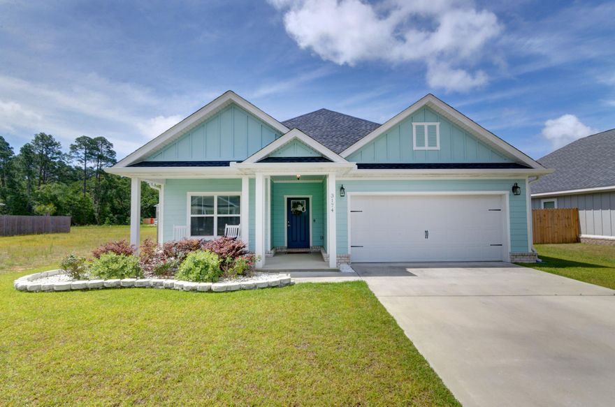 Welcome home to this better than new move in ready stunner! Located in the adorable neighborhood of Heritage Oaks with cottage style homes, this Parade of Home award winning floor plan features 4 bedrooms and 2 bathrooms just minutes from Navarre's beautiful beaches and a short drive to Hurlburt Field. Pull up in the driveway and immediately fall in love with the lovely exterior: from the fun Florida exterior color to the tasteful landscaping, to the inviting front porch with rocking chairs - you are home! Walk inside and appreciate this impeccable interior that shows like a gorgeous model home. Luxury vinyl plank flooring extends throughout, and from the moment you walk down the fantastic entryway you'll love the updates like crown molding throughout and updated modern light fixtures.