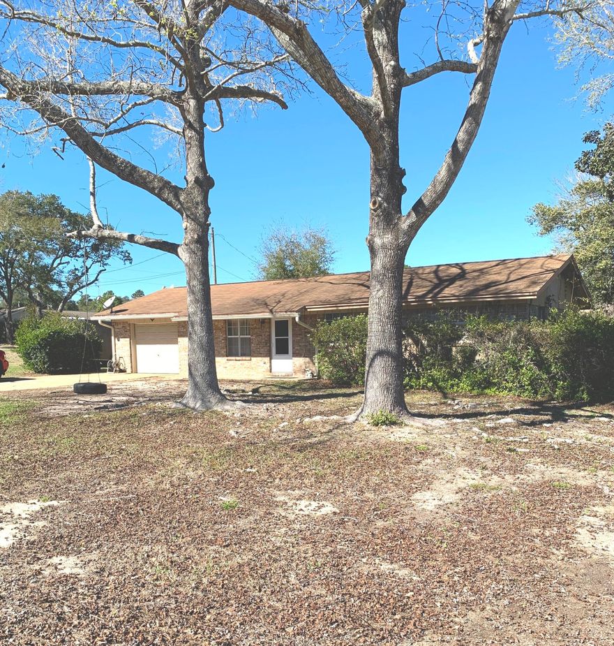 This cozy brick rancher in Shalimar, Florida, has plenty to offer.  Including no HOA fees, flat corner lot, back yard with privacy fence, garage, screened back porch, and convenient to Eglin, Hospital and schools.  LPV flooring.  Has laundry area in garage.
