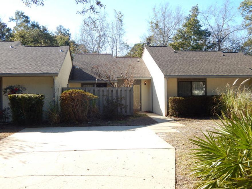 This one level townhouse is in great condition and in a wonderful location. Close to the bay and Bluewater Bay resort and golf. The home has 2 large bedrooms, tiled floors in the entire home with the exception of the bedrooms which are carpeted. There is an inviting sunroom that is fully finished and tiled. (not included in the square footage) The kitchen is roomy with a sunny breakfast nook area, tiled floors, oak cabinetry, a work center and all major appliances. The home is serviced by an efficient HVAC system that is only 4 years old. There is a high vaulted ceiling in the great room and a separate dining area. Backed up to the privacy of woods and a running stream, this would make for a great home to live in or to use as vacation rental investment. This home can be bought furnished.