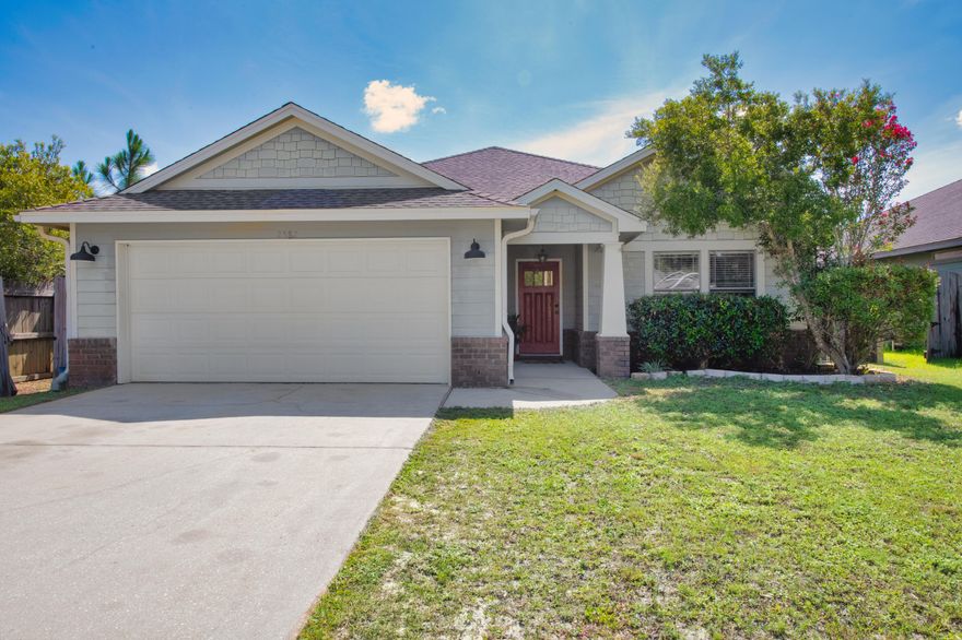 The Cottages is a special neighborhood that presents itself nicer than most HOA  subdivisions. Presenting the newest 3 bedroom 2 bathroom stunning property to the Navarre marketplace. Refreshed with brand new LVP flooring, painted bedroom, updated lighting and 2021 HVAC unit inside and out, manicured landscaping and modern styling cues, this home now represents the greatest value on Hartman Ct. Entering the home you'll love the open concept living space flowing directly into the kitchen. Natural light fills the kitchen and its stainless appliances, large custom cabinetry adds character and flare, yet calls for a custom touch from incoming owners. The master suite has a large walk in closet, trey ceiling, double vanity master bath. The fenced backyard is ready for pets, come check it out!