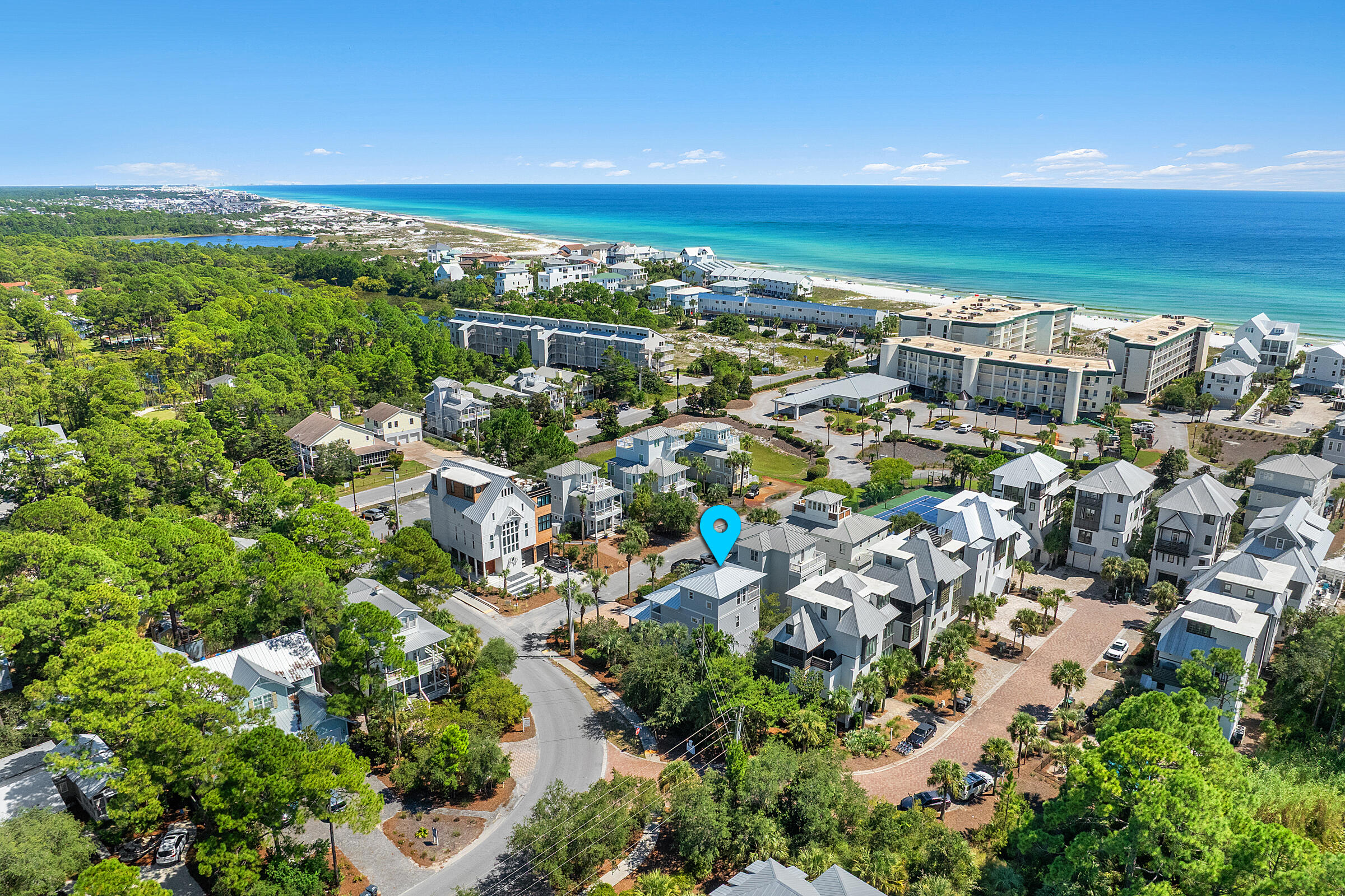 Located south of the scenic highway 30A in the charming Seagrove Beach community of Dunes Estates, this inviting home offers a perfect retreat just minutes from a public access point to the stunning, pristine beaches of the Gulf. The spacious four-bedroom residence is designed for entertaining and relaxation, featuring two comfortable sitting areas, a convenient breakfast bar, and a dining table that seats eight guests. The kitchen is equipped with sleek stainless steel appliances, polished granite countertops, and additional breakfast bar seating for casual meals. On the first floor, you'll find a generously-sized bedroom furnished with a plush king bed and a full bathroom, ideal for guests. Upstairs, the luxurious primary suite, a cozy guest bedroom, and another full bathroom open onto a covered outdoor deck perfect for unwinding and enjoying the gentle sea breeze. The third floor boasts a bedroom equipped with bunk beds and a trundle bed, a full bathroom, and a spacious deck offering breathtaking views of the Gulf and vibrant sunsets. Dunes Estates of Seagrove amenities include a seasonally heated pool and a pickleball court, providing residents and guests with enjoyable outdoor activities. Conveniently situated close to popular local restaurants such as Wild Olives, Local Cantina at Greenway Station, and the Old Florida Fish House, this home offers an ideal combination of comfort, convenience, and scenic beauty.