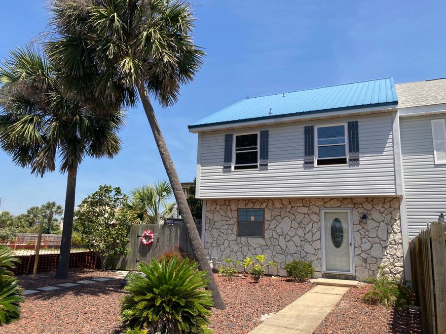 This is not a typical townhome! Custom corner unit Sellers renovated 2015.  Open & inviting main area (25' x 18') with gas fireplace & wood look tile plank flooring; crown molding; 3 exterior doors & cased sliders with glass for natural lighting. Kitchen features granite countertops, custom backsplash, pantry, gas stove, custom hardware on cabinets. 2nd floor features bedrooms & includes a large bonus room off main bedroom leading to outside deck.  Custom tile in both bath floors & showers. Privacy fenced oversize covered side yard & patio with outdoor shower & lush landscaping. 2nd story wrap around deck with 180 degree views, Can view community fireworks & enjoy the island breeze. Public beach access across the street. County Sound/Bay public access under construction next door.