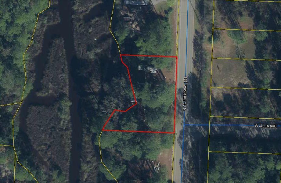 This property consists of two lots plus a 30' easement equaling 130' frontage on 393 with waterfront on the backside of property facing Magnolia Creek and wild life areas. Build your dream home on one lot, opening up possibilities of rental or selling the other lot. Highly desirable location minutes to the beaches of So. Walton. Motivated seller.No value in the structures, just the land
