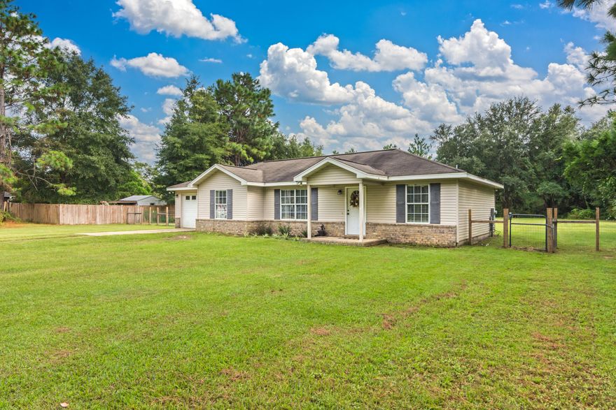 Stop the car and look no farther this beautiful country charmer is a must see. Your new home offers peace and quite with the convenience of being 15 mins from the heart of Crestview, an easy drive to our local bases, and white sandy beaches on the emerald coast. Your new home offers a large/level fenced in back yard that is perfect for the kids to play and dogs to roam. You will also find a large covered back porch that is ideal for family gatherings and weekend bbqs with friends. Inside you will find a semi open/split bedroom floor plan that is great for entertaining, high vaulted ceilings in the living area, and an oversized one car garage. This home won't last long so call to schedule you private viewing today!