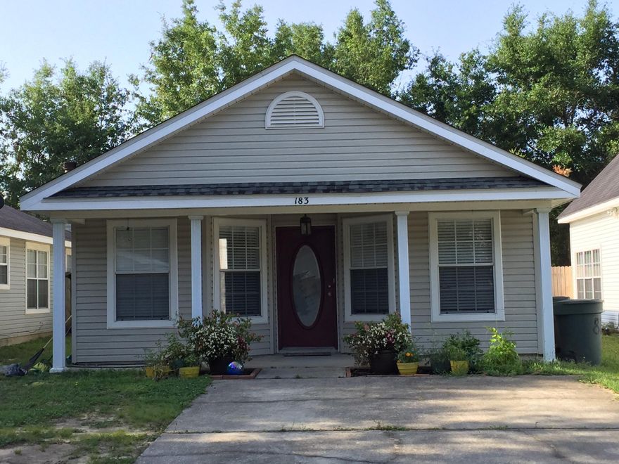 Adorable Victorian style home in Cottages at Grandpointe ~ This 3 bedroom/ 2 bath is move in ready, in great condition! Hardwood flooring through the main living spaces, large tile in entry and baths, and carpet in bedrooms. Kitchen features a stainless steel drop in stove with smooth cooktop and a stainless steel dishwasher. The master suite has a trey ceiling, double vanity with framed mirrors and a walk in closet. The backyard is fenced on three sides and features a shed for extra storage. Blinds adorn all the windows and there are ceiling fans as well. A covered patio is a comfortable addition to the home. This great neighborhood is located very close to I-10 off Scenic Highway, giving an easy commute into Pensacola or Milton and points in between.