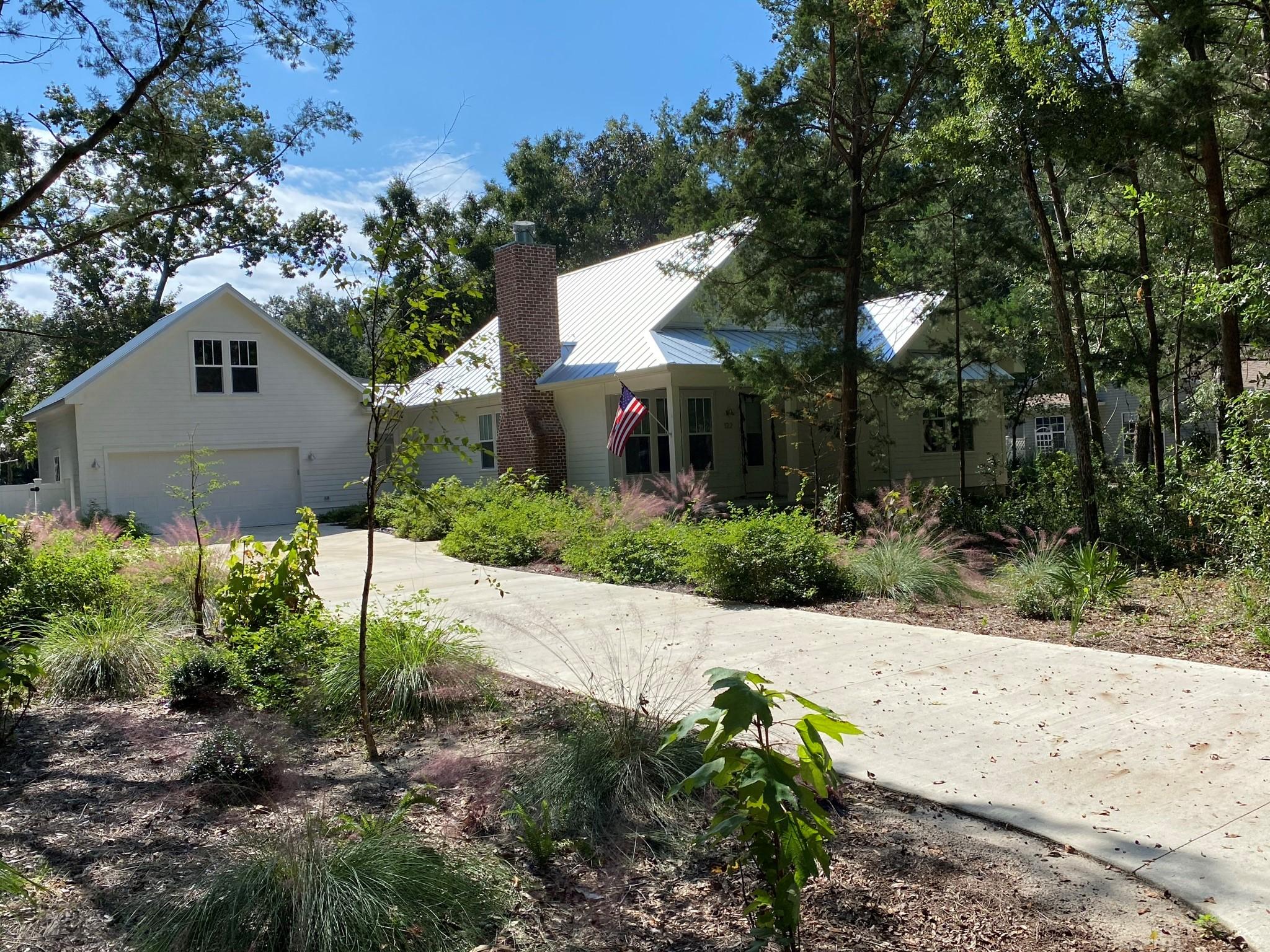 As you enter the quaint 27 home neighborhood of Fischer's Landing, you will quickly realize that this neighborhood is a step back in time to Old Florida. The canopy of oaks, hickory, and magnolia trees create a natural setting and an immediate sense of relaxation. The private community dock offers immediate bay access for swimming, paddle boarding, and some of the best fishing Choctawhatchee Bay has to offer. Located directly in the heart of the subdivision is 122 N Blue Heron Dr, a custom built cottage constructed in 2019. This 3 bedroom 2 full bath home with 2 car garage is the perfect mixture of modern day amenities accented by classic Florida cottage charm. Curb appeal is abundant with the inviting front porch and low maintenance hardy plank siding.