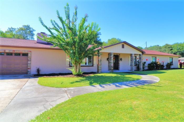 **Bring and offer and close before Dec. 1 and receive an additional $5,000 off already reduced price!!** Welcome Home to your mini estate, located on just over half an acre, in the heart of Fort Walton Beach! Surrounded by Palm Trees, Crepe Myrtles, Magnolia, & Live Oak Trees, you'll find plenty of shade to keep you cool during the hot Summer months, but if that doesn't do the trick, you can take a dip in your large 18x36 foot gunite pool, surrounded by an 1100 square foot paver patio! Don't let the age of this home fool you as all 3,250 square feet have been completely renovated & updated throughout. This home boasts hardwood floors in the kitchen & dining rooms; faux wood tile throughout the living room, foyer, & hallway; travertine tile in the entryway, around the wood burning fireplace, and two bathrooms; crown moulding throughout the entire home; trey ceilings in the kitchen, dining room, and living room; and custom Roman Shades in the Living Room, Dining Room, Den, and Master Bedroom. The kitchen will bring out the inner chef in everyone, & includes plenty of storage with its custom cabinets, granite countertops, large center island, & stainless steel Kenmore Elite and Whirlpool Gold appliances, including gas stove and electric double oven (Refrigerator conveys). The spacious Master Bedroom features a large walk-in closet with closet organizer and sliding glass door to the backyard. The Master Bath features an antique style double vanity with granite countertops and tub/shower combo. Bathroom #2 features a travertine walk-in shower, antique style vanity with granite countertop, and clawfoot tub. The Living Room boasts a large bay window & wood burning fireplace and the den features new wall to wall carpeting & wet bar, perfect for those nights of entertaining, including sliding glass door to the backyard. Oversized garage has plenty of space for storage, and oversized driveway has plenty of room for boat/RV parking. Home is wired with state of the art ADT wireless security system, featuring 2 outdoor cameras and monitor. Roof was replaced in 2013 & all new double pane windows were installed in 2013. HVAC was replaced in 2009 and Everclean Green Coil System was installed in 2014. Home has an active termite bond with Bryan Pest Control and is transferable to new owner. Many additional upgrades have been made and you can view the entire list under the documents tab. Sellers offering 1 year home warranty with Old Republic. Call today to schedule your own private viewing!