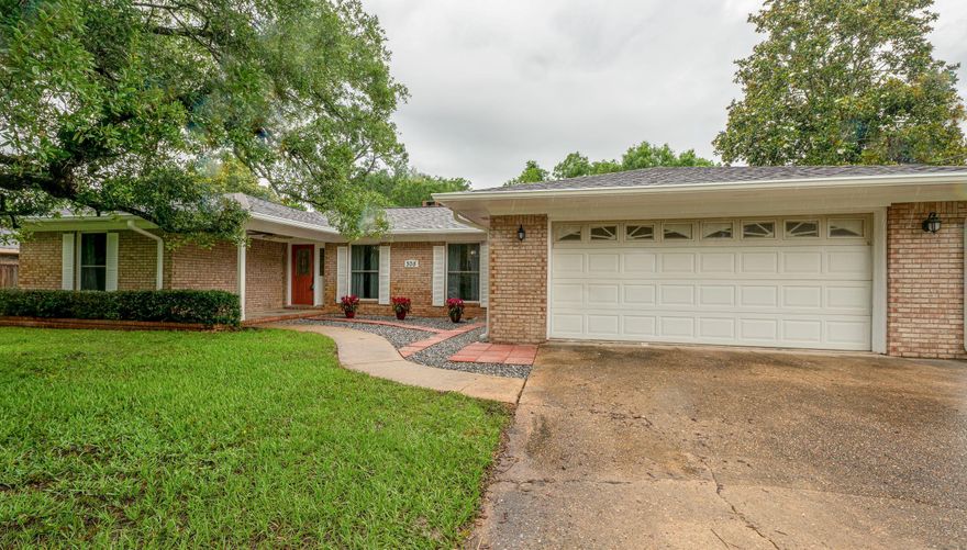 Stunning Remodel! Covered porch leads to open concept foyer/living/dining area.Two of the 4 bedrooms are master bedrooms with en suite baths and sliding doors that lead to a patio. One master has a separate entrance and could be a mother-in-law suite. Contemporary Driftwood Luxury vinyl tile installed throughout as well as new lighting, fresh paint, and windows within 5 years old. Kitchen features gorgeous granite counters, plenty of cabinets, stainless steel appliances, double ovens and a large island for food prep. Two of the three baths have been renovated with upgrades such as tiled showers and granite vanity tops. Large .42 acre lot with a huge backyard and a bonus shed/workshop. Plenty of room for a pool. Two car garage is attached. Separate laundry room and new roof.