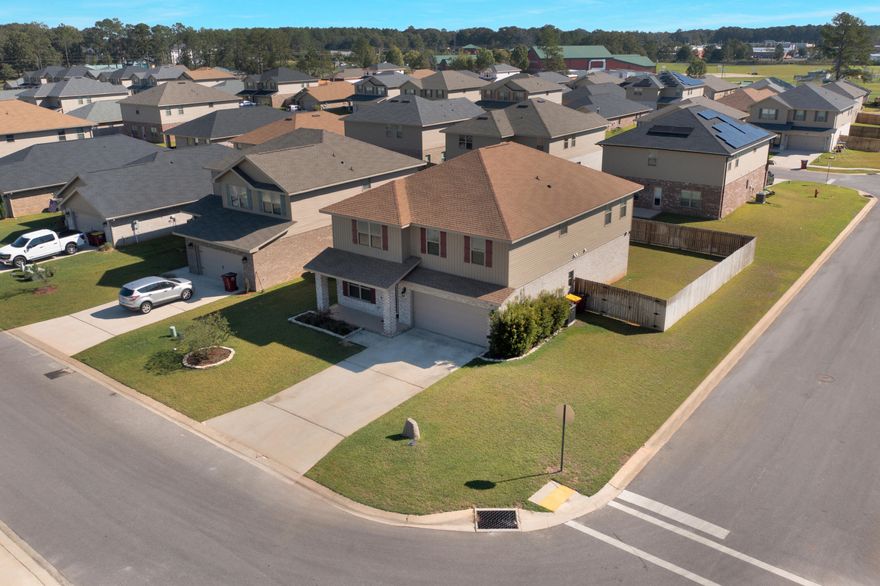 This spacious 3,270 sq ft home is perfect for families, offering 6 generous bedrooms, 3.5 baths, and a convenient main‑floor primary suite. Two large living areas and an open‑concept kitchen provide plenty of room to gather, play, and relax. Upstairs, the secondary bedrooms sit close to a handy laundry room. The corner lot and fully fenced yard create a great space for outdoor fun and privacy. Custom plantation blinds and a security system with video surveillance add comfort and peace of mind.