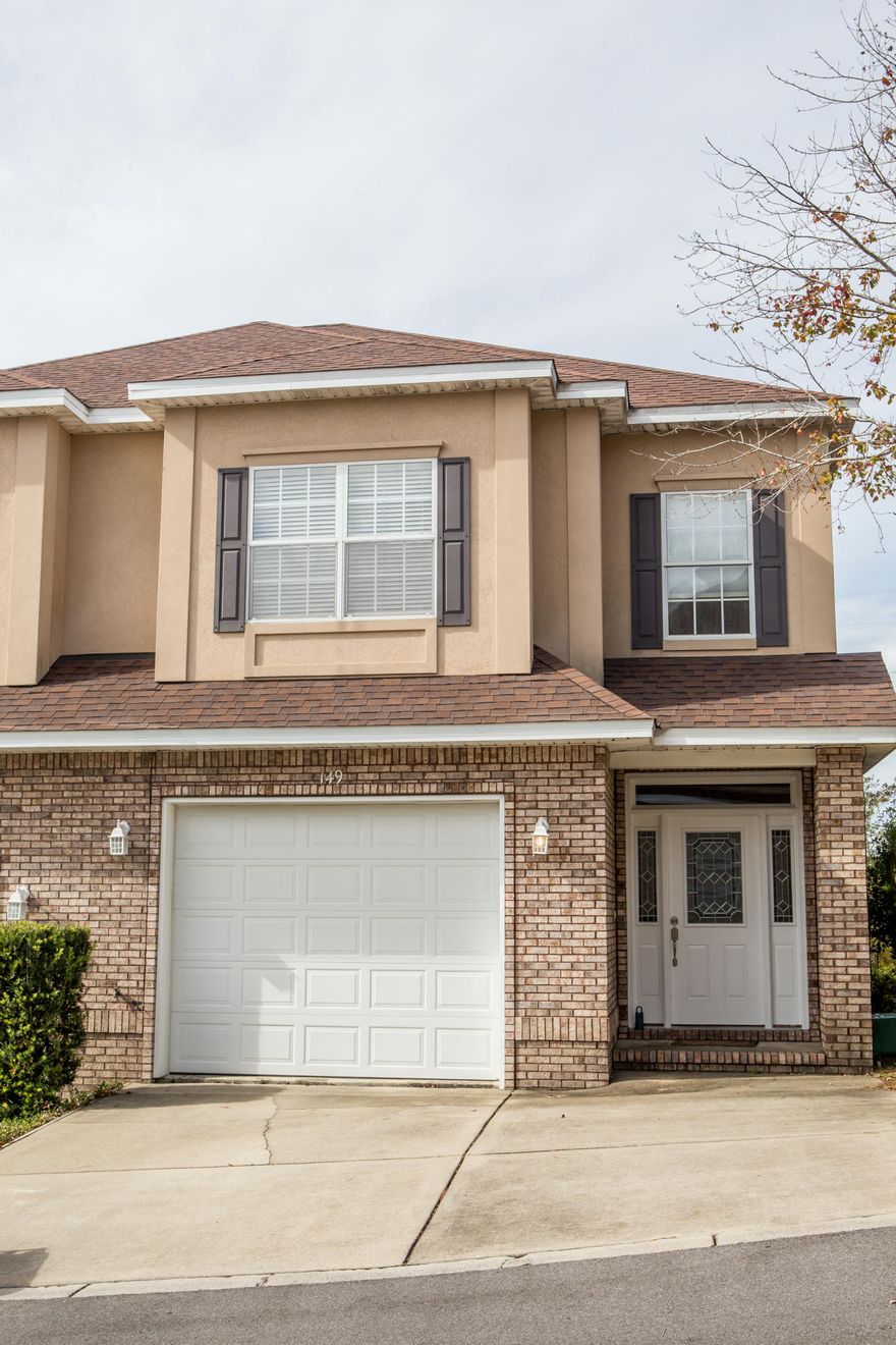 End Unit with exceptional living spaces. This community of Walton Oaks offers easy access to the bases and the surrounding community. Turkey Creek is down the street for hiking, canoeing or swimming or simply hanging out.Yard maintenance is provide by the HOA. Open concept with family, kitchen and dining areas. Fireplace for cool Florida nights.Plenty of storage in kitchen with maple cabinets and hard surface counter tops. Breakfast nook leads to the open deck that looks out toward Turkey Creek. Master suite on the first floor with garden tub and separate shower in bathroom. Half bath for your guest. Upstairs you will find 3 additional bedrooms and 2 bathrooms. Down the stairs on the deck will lead to heated and cooled workout room or even an office. Home warranty. Must See!