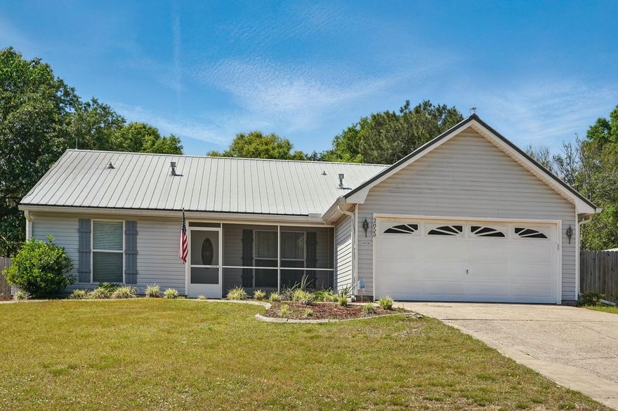 NEW HVAC 2025 ! Welcome to a fantastic home featuring a screened in front and back porch, a full size state of the art workshop with electricity and oversized driveway. This beautiful 3-bedroom, 2-bath home is nestled in a peaceful, family-friendly neighborhood. Offering a warm and inviting atmosphere, the living and dining areas are perfect for both relaxing evenings and entertaining guests. The kitchen features ample cabinet space and a convenient layout. The primary suite includes a private en-suite bathroom and generous closet space, while the additional two bedrooms are ideal for children, guests, or a home office. Step outside to enjoy a spacious backyard, ideal for gardening, grilling, or simply unwinding after a long day.