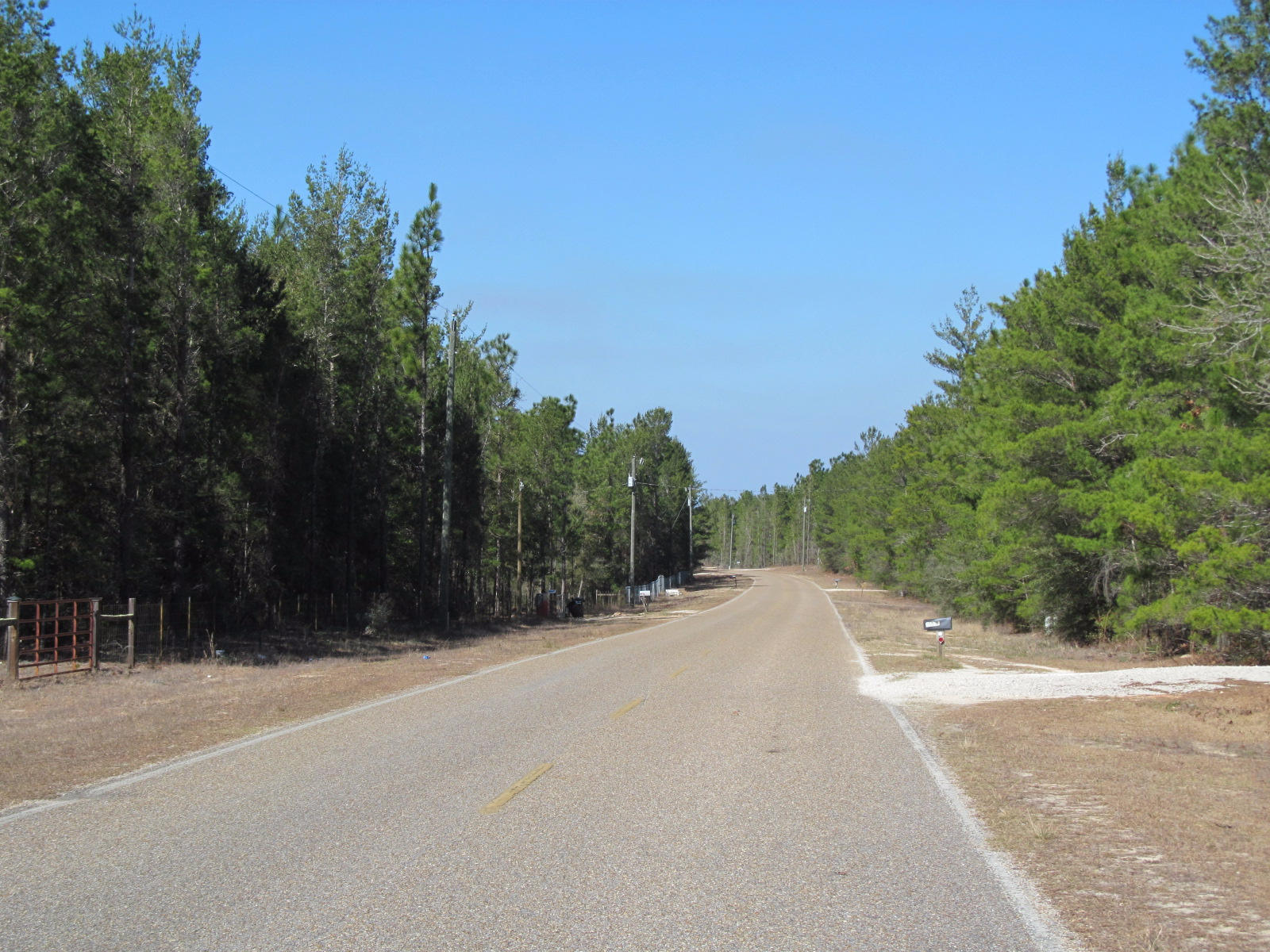 8.8 acres . partially fenced. wooded. level. Easy access to Hwy 285, Niceville and the back gate of Eglin AFB. Paved Road frontage. Mossyhead water available. Price right. Mobiles welcome. The adjoining 8.7 acre parcel is also for sale.