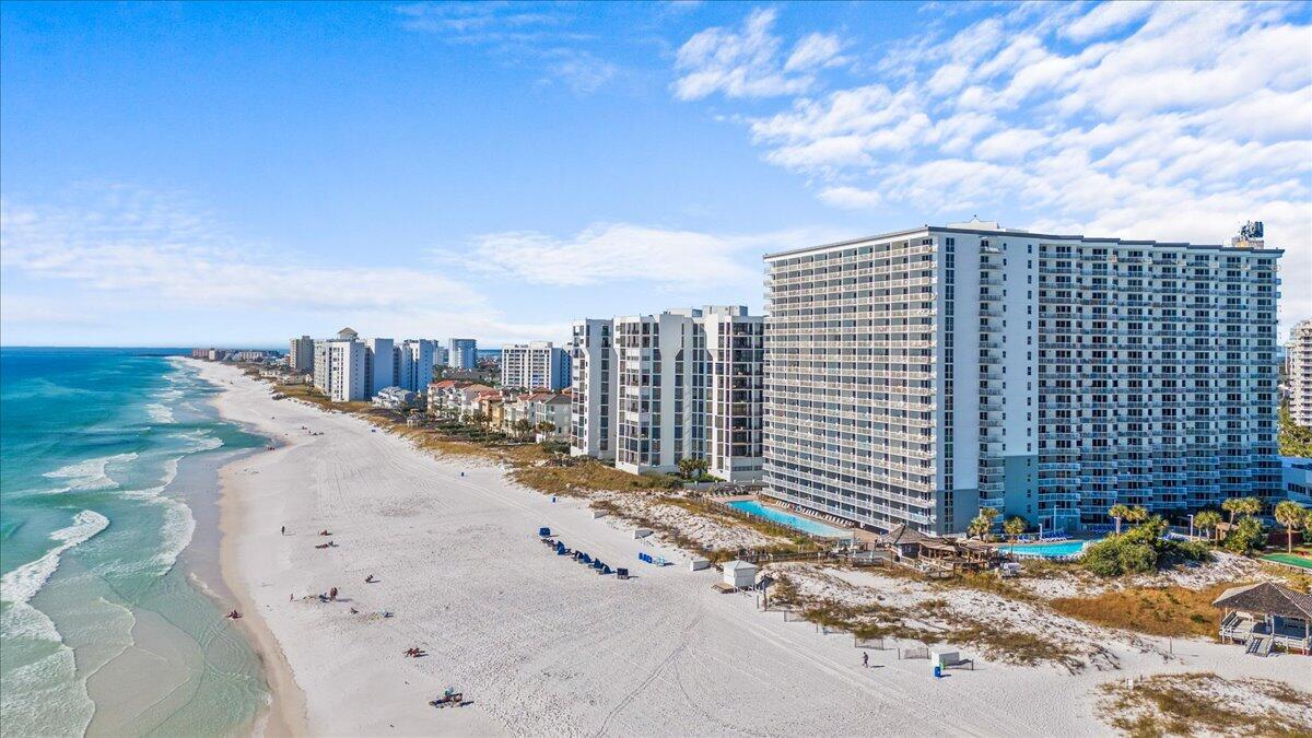 Experience beachfront living in this beautifully RENOVATED 1-bedroom, 2-bathroom condo at Pelican Beach Resort! Enjoy captivating GULF VIEWS of white sand beaches and emerald waters from your private patio!The condo features LVP flooring throughout, a fully renovated kitchen with GRANITE countertops, stainless steel appliances, and soft-close cabinetry. The primary bedroom includes an en-suite bath with a luxurious tub/shower and newly tiled surround. Built-in hallway bunk beds and a second remodeled bathroom with a tile shower provide extra accommodations for guests. Living room complete with sleeper sofa, and patio access for spectacular views of the Gulf and community pool!Sold FULLY FURNISHED, this is a turnkey investment or personal getaway! Pelican Beach Resort is known for its exceptional amenities, including:
Beachfront zero-entry 114-ft pool and 3 additional pools (including indoor).
12-seat spa, sauna, and steam room.
2 State-of-the-art fitness center.
Caf??, tiki bar, tennis, pickleball, game room, and beach service.
Covered parking, EV charging, and 24-hour security.
Your paradise awaits at Pelican Beach Resort!