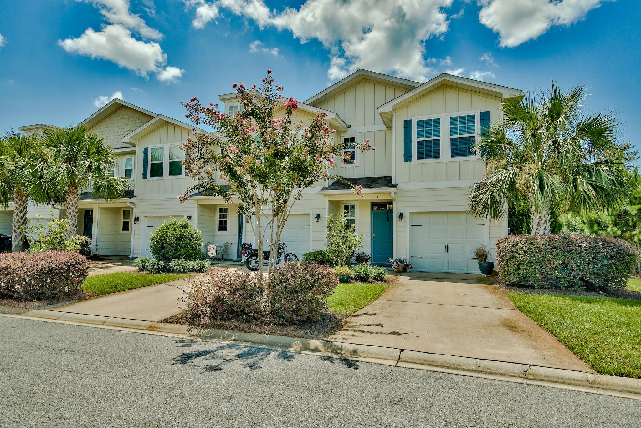 Phenomenal opportunity to own the best priced townhome at Water Oaks, an attractive community located just a mile from South Walton's beautiful beaches and Scenic Highway 30A, yet also close to Choctawhatchee Bay. This 3-bedroom, 2.5 bath townhome is ideally an end unit for additional privacy and slightly more square footage. There is beautiful curb appeal with the lush tropical landscaping and covered front porch including a quaint sitting area. Enjoy the coastal Florida cottage design with hardiboard exterior and teal accent shutters and door. Interior boasts an open floor plan ideal for entertaining with the main living areas downstairs, access to a back porch, raised ceilings and crown molding. Tile floor extends throughout the first floor and there is a half bath for convenience.