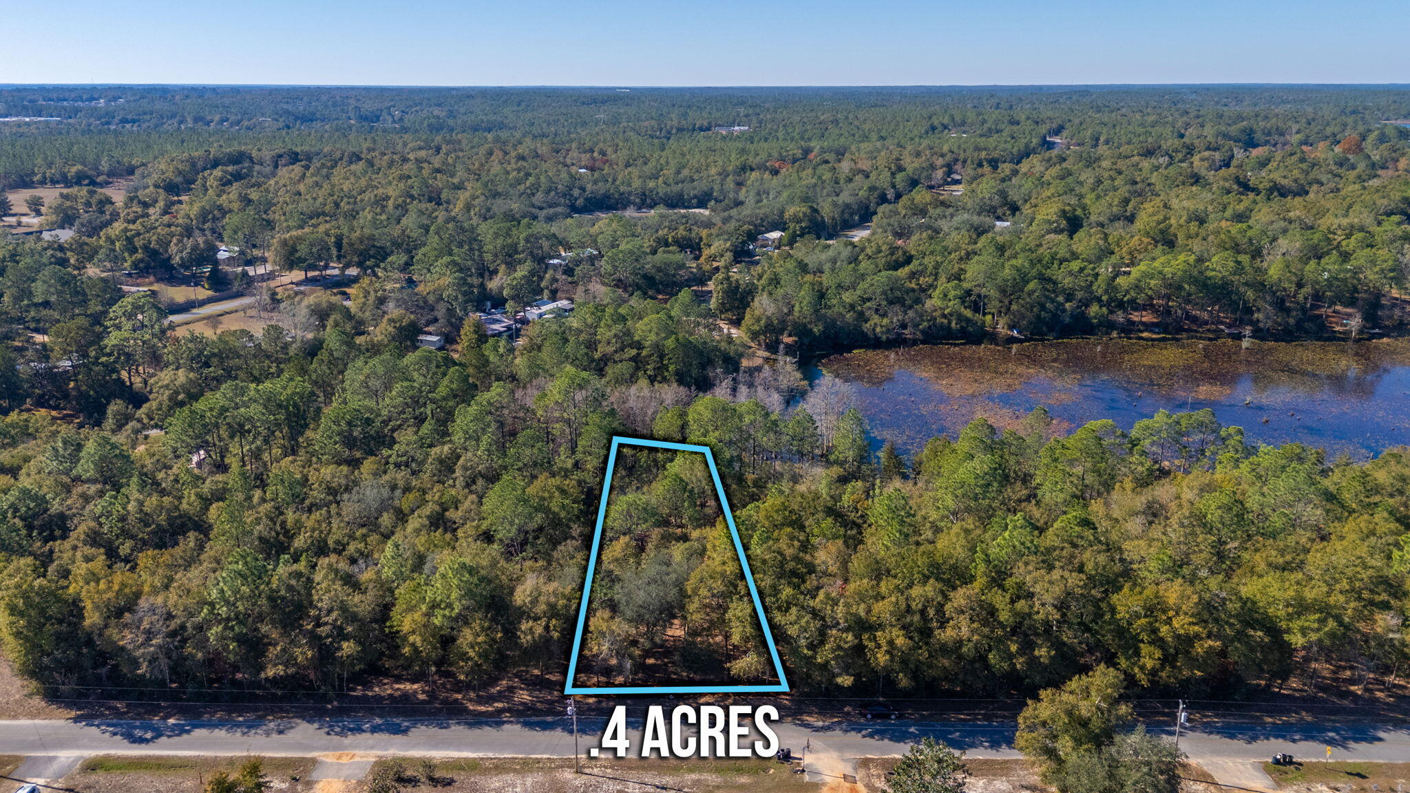 Discover the perfect canvas for your waterfront retreat on this .40 acre lot nestled on Juniper Lake. Recently surveyed and professionally mulched, this property offers a clean, open view, making it easy to envision your future plans. With no HOA fees or restrictions, you have the freedom to design and build your ideal space without limitations. Power & public water are easily accessible at the street. A septic system would be needed. Enjoy direct lake access for tranquil mornings, vibrant sunsets, and endless recreational opportunities like fishing, kayaking, or simply soaking up the natural beauty. The adjacent .39 acre lot is also available for purchase, offering an incredible opportunity to expand your lakeside haven.