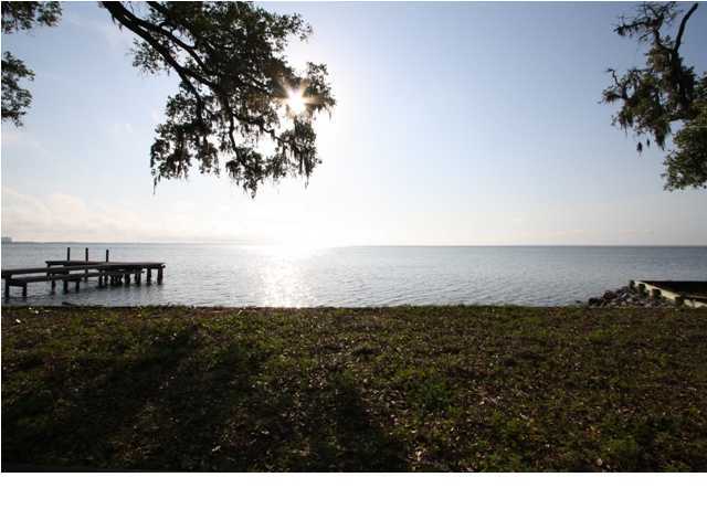 RARE OPPORTUNITY. Looking for the perfect bayfront lot to build your custom THE OAKS OF BURNT PINE -- a gate within a gate! Enjoy spectacular sunsets with the western orientation. CALL TODAY FOR MORE DETAIS.