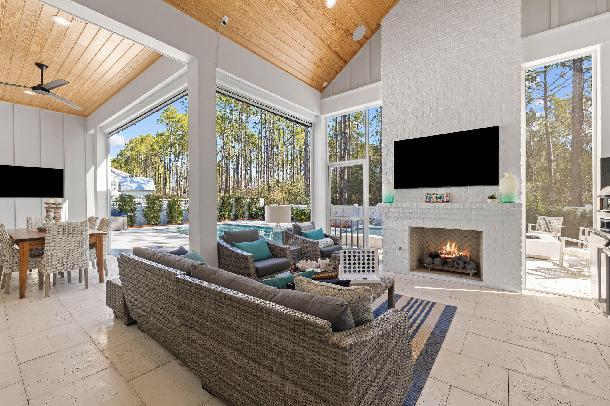 This one-of-a-kind 4-bedroom, 5.5-bath home in the highly sought-after community of Watersound Origins has been meticulously customized to offer unparalleled luxury and functionality. This custom-built masterpiece constructed by Key Lime Construction has been designed to blend luxury, comfort, and coastal charm with a seamless combination of modern elegance and functional living. The home features an open-concept floor plan filled with natural light from the many windows throughout. The heart of the home is the gourmet kitchen, a chef's dream equipped with Wolf appliances, a Sub-Zero refrigerator, and upgraded 3-inch marble-edge countertops. The expansive island provides ample space for meal preparation, casual dining, and hosting gatherings. Adjacent to the kitchen is a custom-built wine cellar with a glass enclosure and elegant lighting, ideal for showcasing your collection. The custom-built pantry is an incredible addition to complete the chef inspired kitchen. The kitchen overlooks the living room which offers an inviting ambiance, complete with a theater system for entertainment and anchored by a stunning Omega Mantle with a limestone finish. Throughout the home, every detail has been considered, including two laundry rooms with custom cabinetry and built-ins, as well as custom window coverings and rugs that enhance the overall design.
The primary bedroom, located on the first floor, is a true retreat with a California Closets-designed walk-in closet and a spa-like ensuite bathroom featuring Dolomite marble, dual vanities, a soaking tub, and a walk-in shower. A guest suite with a private bath is also conveniently located on the first floor, offering an ideal space for visiting family or friends.
Upstairs, you'll find two additional bedrooms, each with its own ensuite bath, and playroom. There is also an amazing flexible space that can serve as an office, lounge, or play area. Adding to its versatility, there is an additional 100+ square-foot bonus room off one of the upstairs bedrooms, making it the perfect playroom for kids or a cozy retreat for hobbies.
For your guest or friend's sleepovers, there is an amazing carriage house located above the garage but connected to the home. It is finished with custom bunks, a kitchenette and living space perfect for friends and family.
The home is completed with the amazing outdoor living spaces designed to create a seamless connection between comfort and nature. The back porch and outdoor area feature roll-down screens, two retractable panels, and an upgraded screen door, providing year-round versatility. The oversized pool with an integrated hot tub serves as a centerpiece, surrounded by amenities perfect for entertaining, including a limestone fire pit, a Gozney pizza oven, a Recteq smoker with light and gas grill. The home also includes a custom dog run with fencing and dog doors that lead directly into the home. The outdoor space is further enhanced with two mounted TVs and a state-of-the-art audio system that extends to the porch, outdoor area, garage, and craft space. This home also offers modern conveniences, including a Generac whole-home generator and a whole-home water filtration system for added peace of mind.
Located in Watersound Origins, residents enjoy access to exclusive amenities, including a fitness center, pool, and scenic nature trails. Just moments away from pristine beaches, parks, and the vibrant culture of the area, this home is perfectly situated to provide a lifestyle of both tranquility and activity.
With its fully customized design, exceptional features, and thoughtful layout, 698 Medley Street offers an unparalleled living experience in one of the most desirable streets in Watersound Origins.