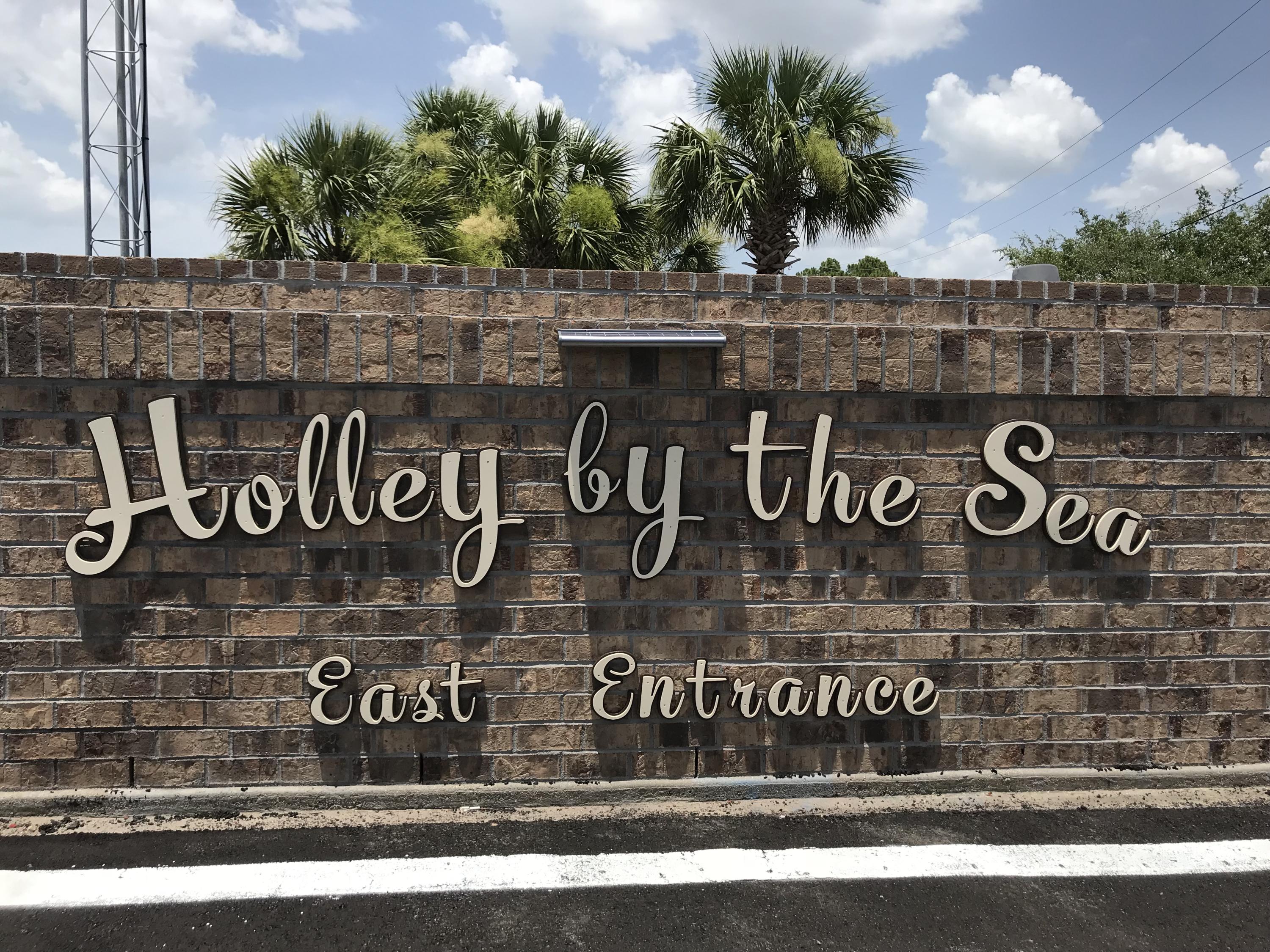 Oversized lot 1.1 acres! Spacious and Affordable 1.1 Acre Lot in Holley By The Sea! Ownership includes membership to Holley by the Sea's multi-million dollar 45 acre recreational center with 8 clay tennis courts, 3 swimming pools, full gym, aerobics, summer camp, lighted basketball courts, sauna & steam room, playground game room, community house on Santa Rosa Sound with playground, dock, access to the East Bay boat launch and many community events. Only minutes to the pristine white sugar sand beaches and emerald water of the Gulf of Mexico.